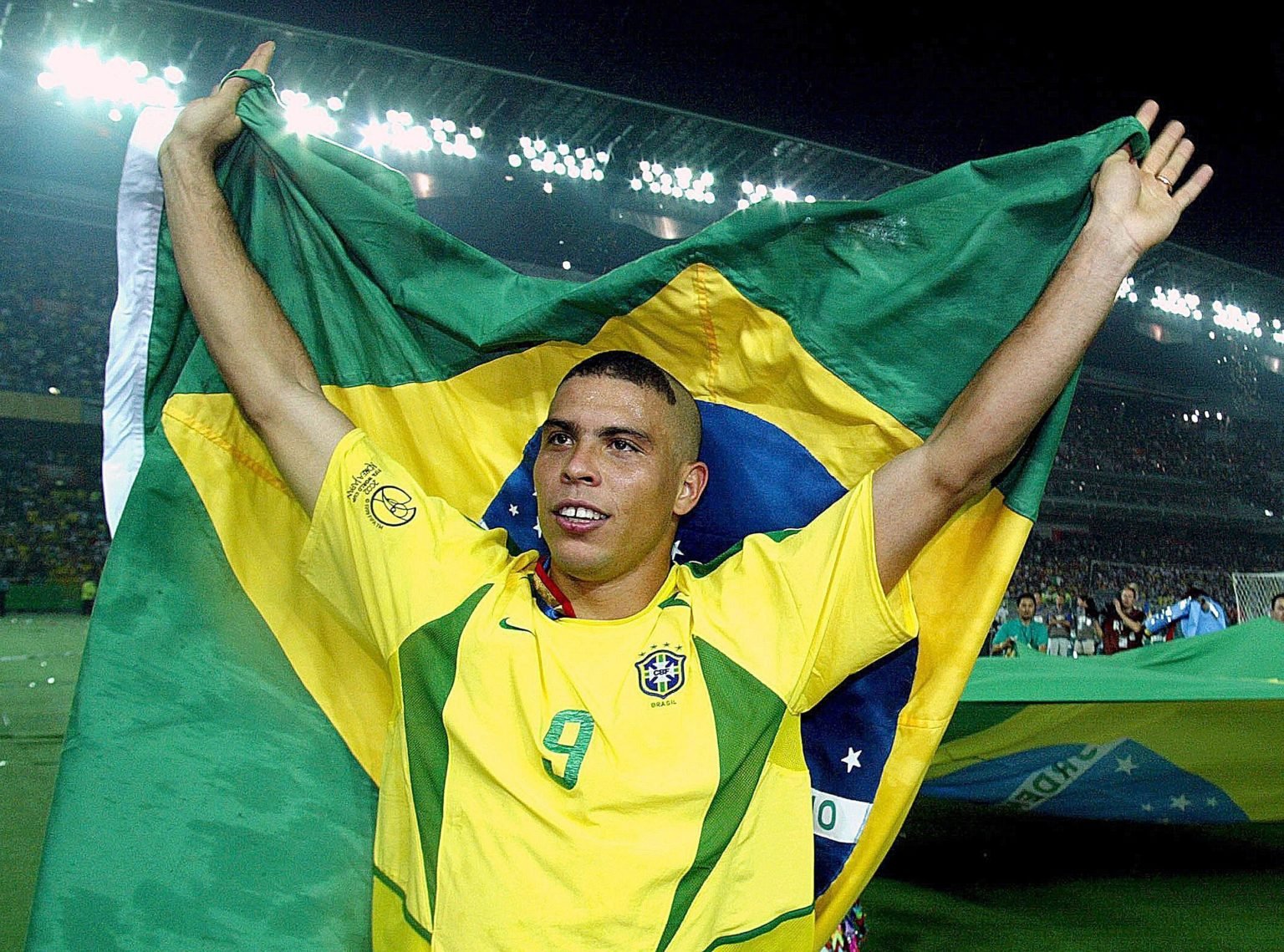 Ronaldo Luís Nazário de Lima of Brazil celbrates the victory with the brazilia flag after the Fifa World Cup Final 2002 match between Germany and B...