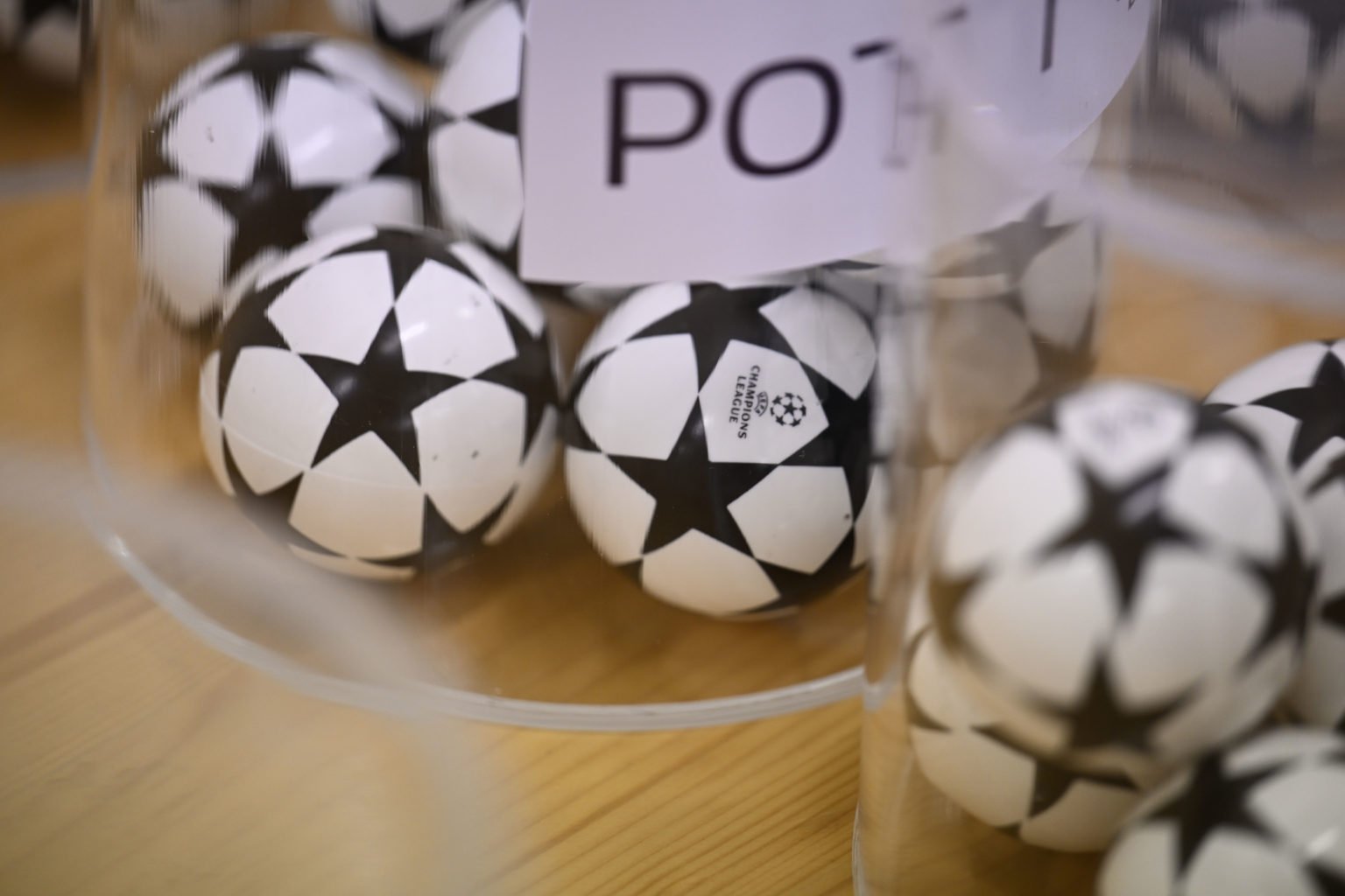 A general view of the draw balls on the pots ahead of the UEFA Champions League 2022/23 Play-offs Round Draw at the UEFA headquarters, The House of...