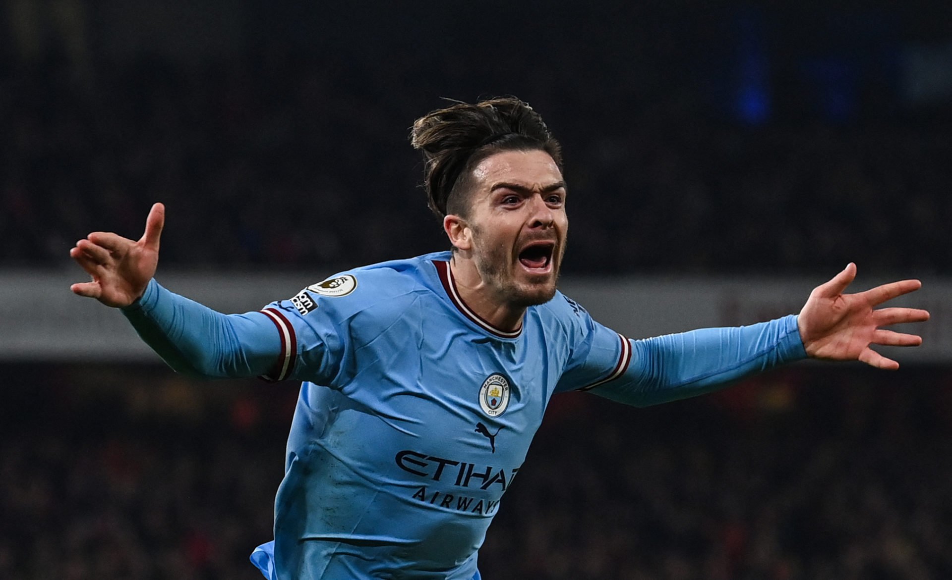 Manchester City's English midfielder Jack Grealish celebrates after scoring his team second goal during the English Premier League football match b...