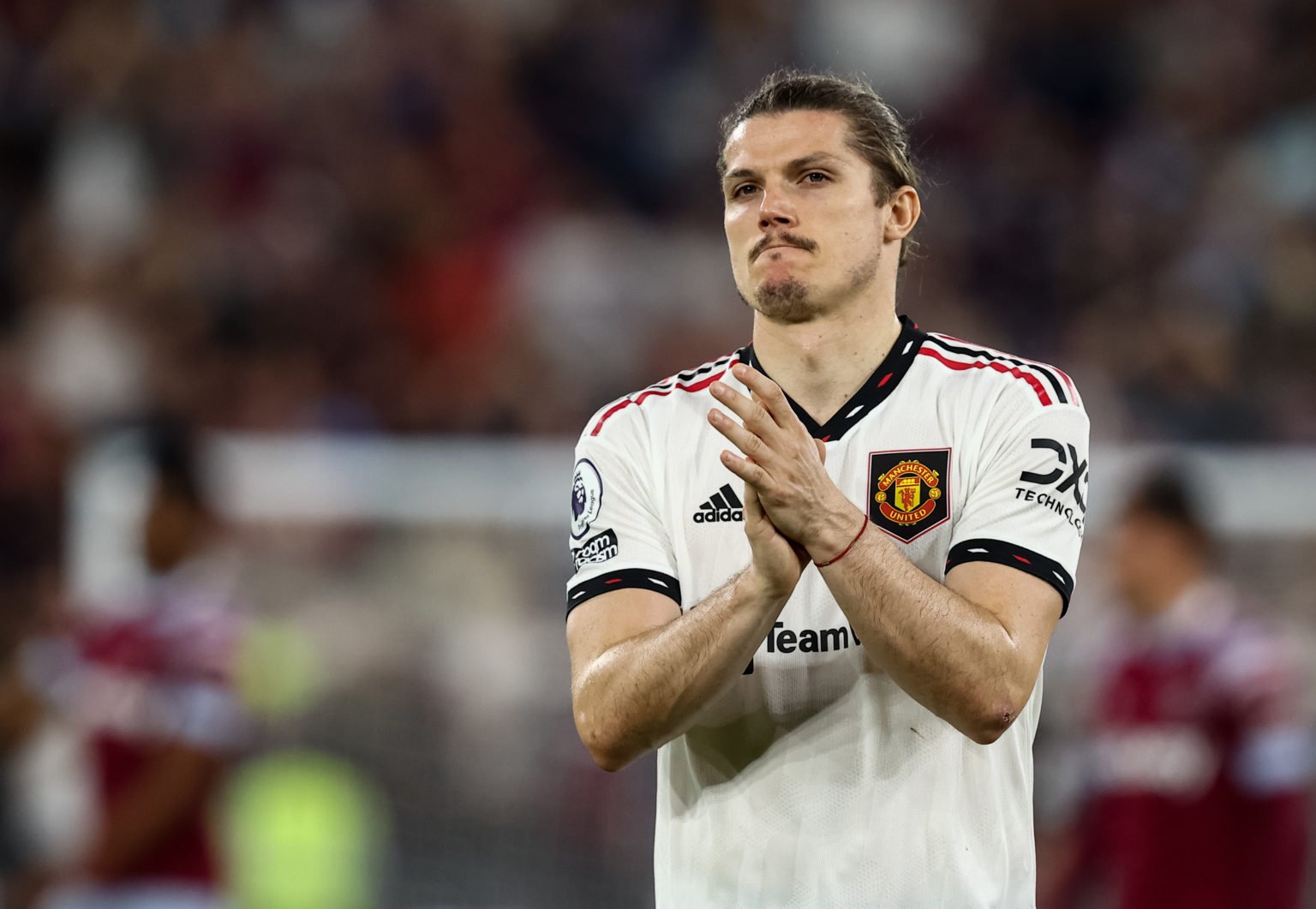 Manchester United's Marcel Sabitzer applauds his side's travelling supporters at the end of the match during the Premier League match between West ...