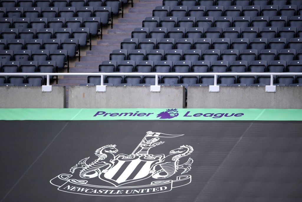 General view inside the stadium where a Newcastle United banner is seen alongside the Premier League logo prior to the Premier League match between...