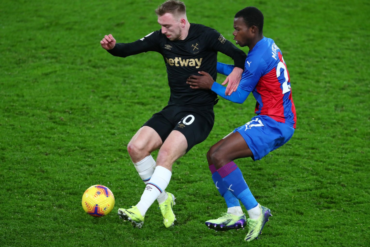 Jarrod Bowen of West Ham United is challenged by Tyrick Mitchell of Crystal Palace during the Premier League match between Crystal Palace and West ...