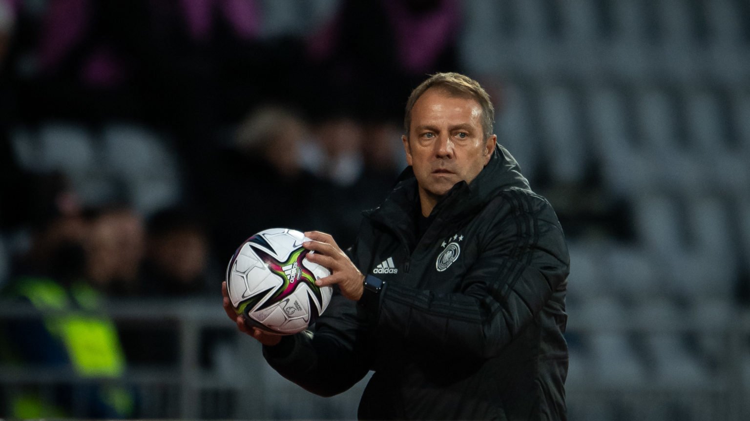 Hansi Flick, Head Coach, of Germany throws a ball during the 2022 FIFA World Cup Qualifier match between Iceland and Germany at  on September 08, 2...