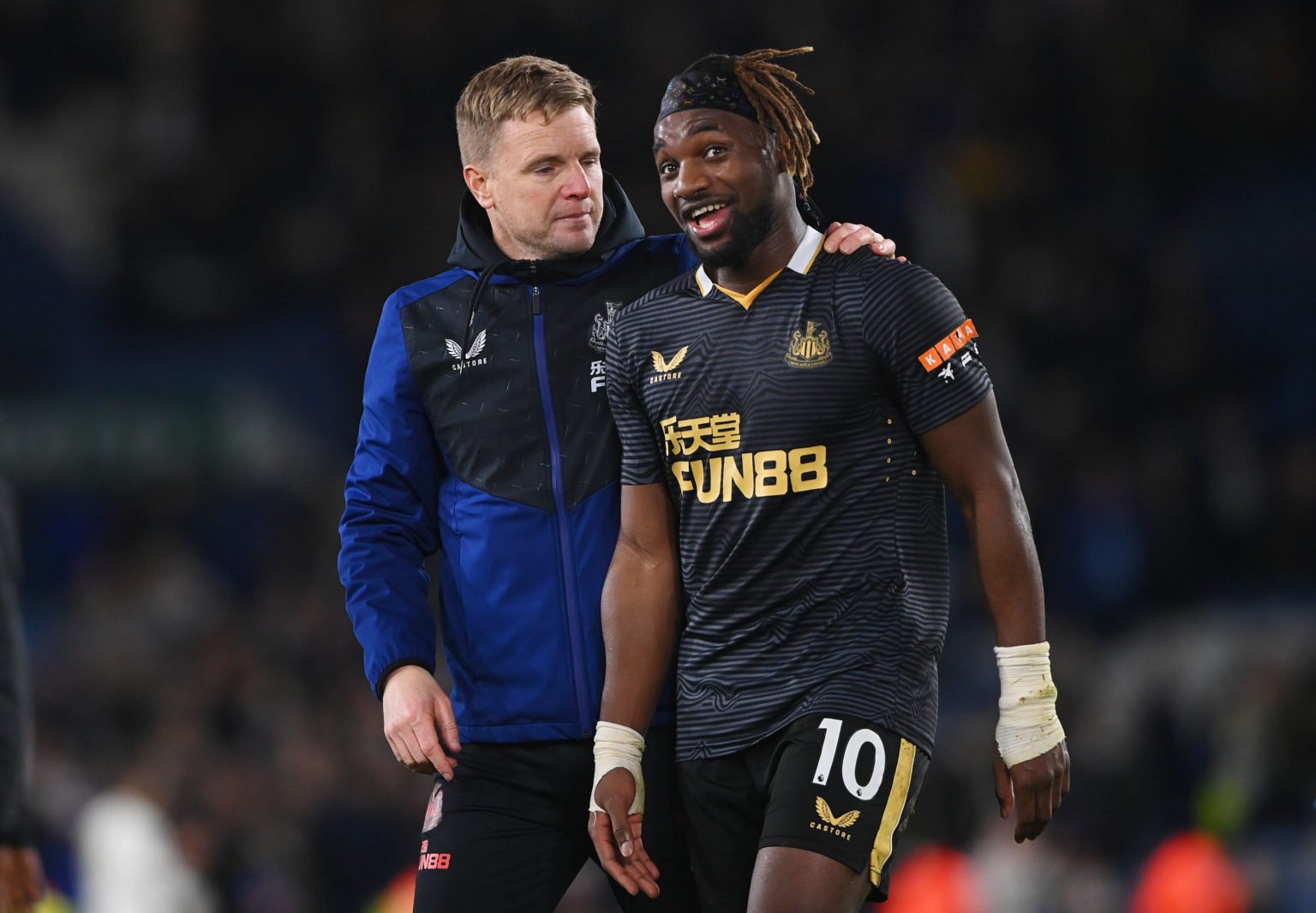 Eddie Howe embraces Allan Saint-Maximin of Newcastle United after their sides victory during the Premier League match between Leeds United and Newc...