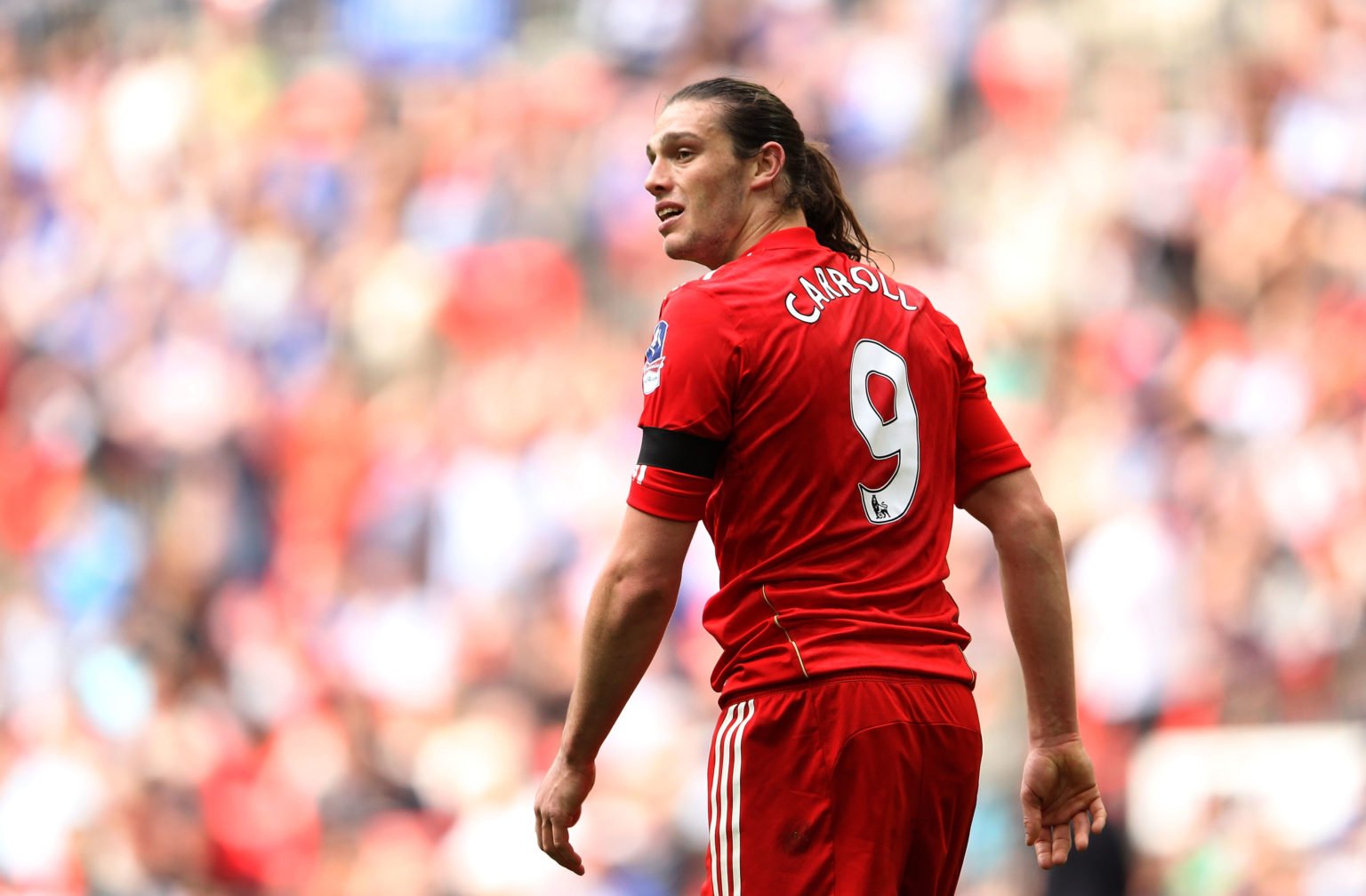 Andy Carroll of Liverpool looks on during the FA Cup with Budweiser Semi Final match between Liverpool and Everton at Wembley Stadium on April 14, ...