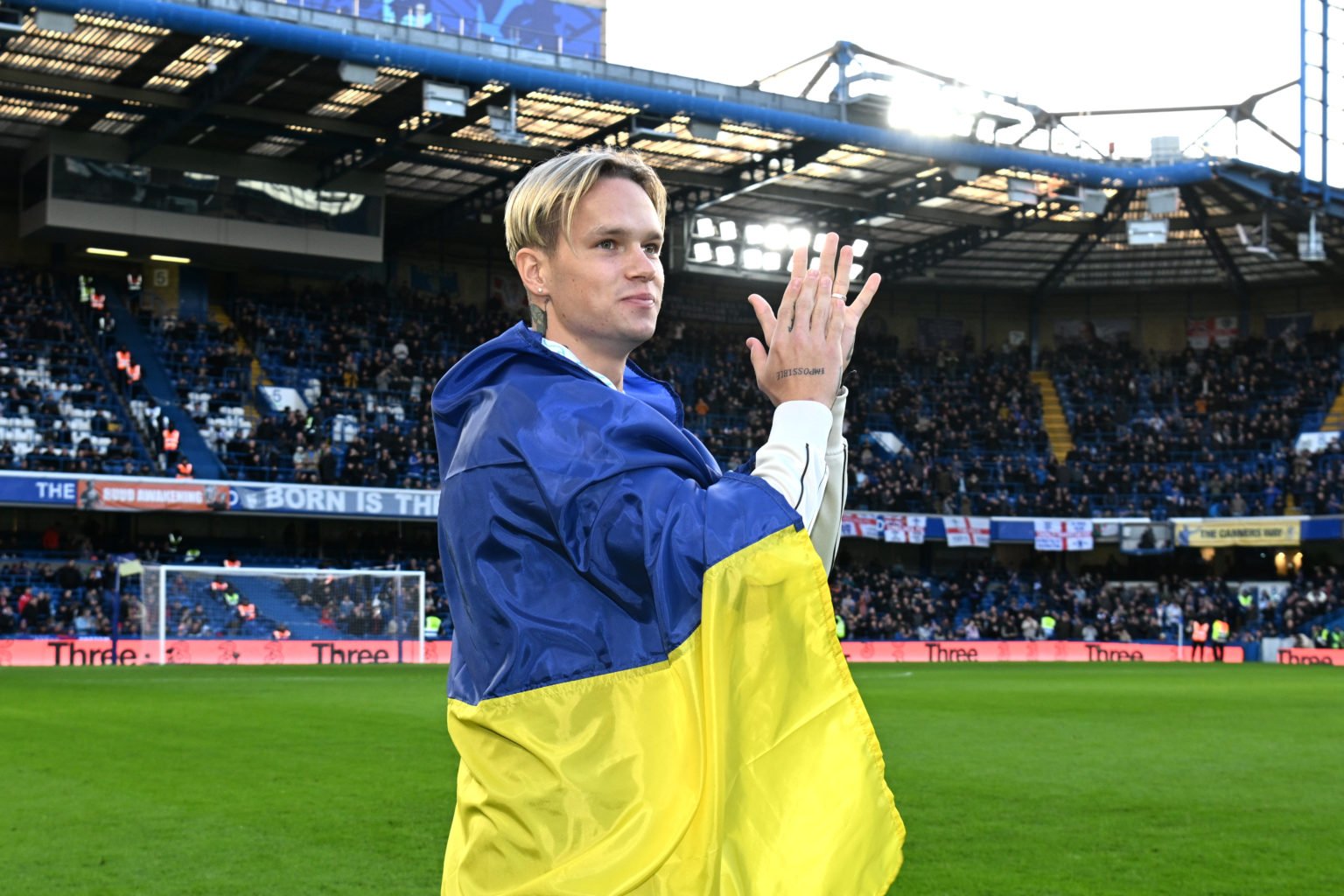 New Chelsea FC signing, Mykhaylo Mudryk applauds while being introduced to the fans on the pitch at half time during the Premier League match betwe...