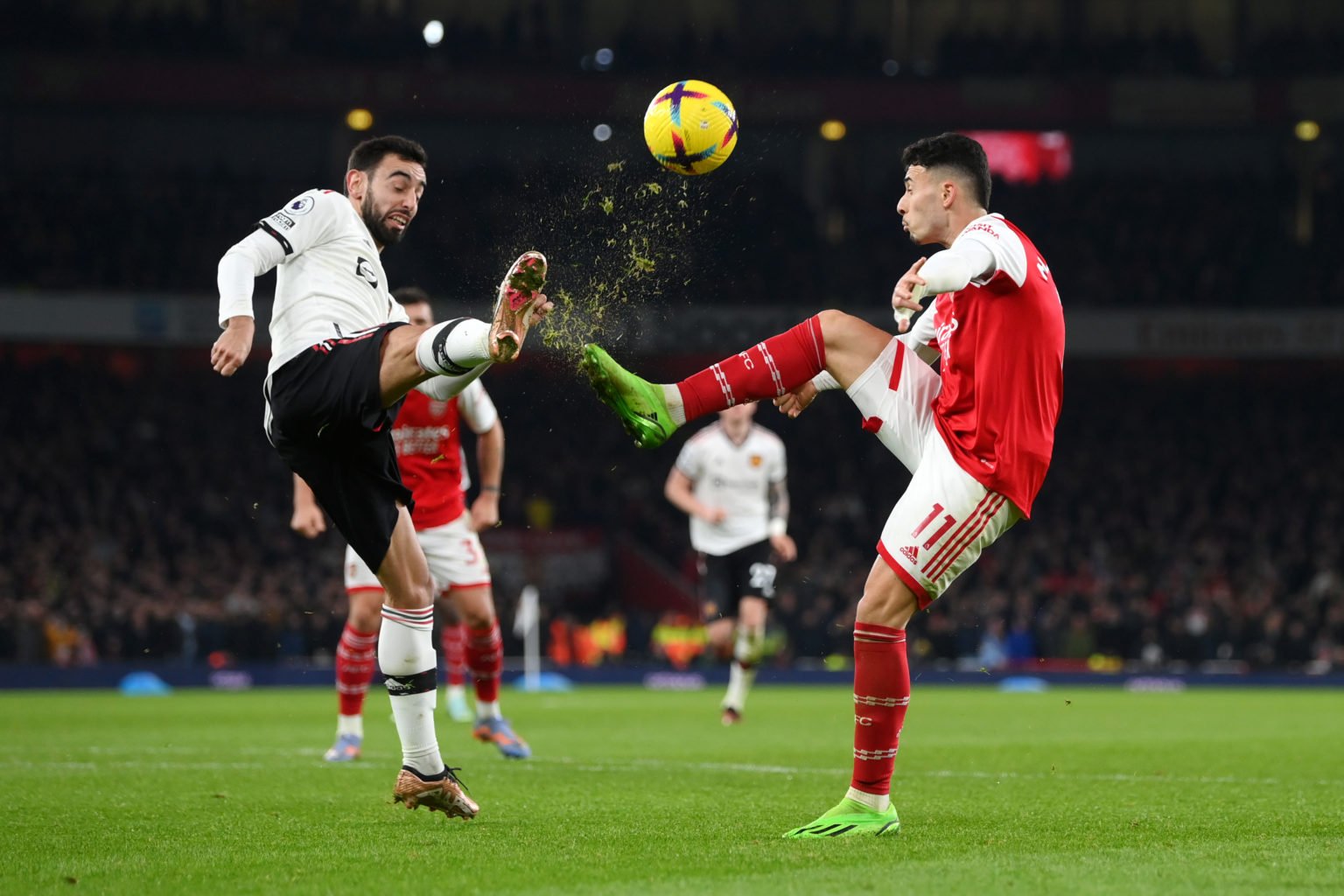 Bruno Fernandes of Manchester United battles for possession with Gabriel Martinelli of Arsenal during the Premier League match between Arsenal FC a...