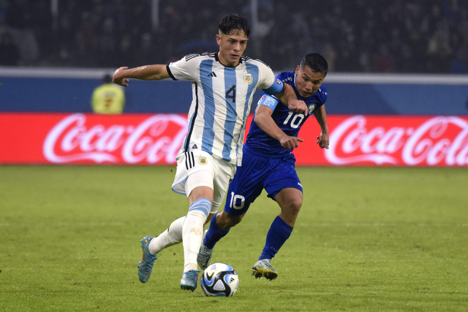 Agustin Giay of Argentina fights for the ball with Umarali Rakhmonaliev of Uzbekistan during the FIFA U-20 World Cup Argentina 2023  Group A match ...