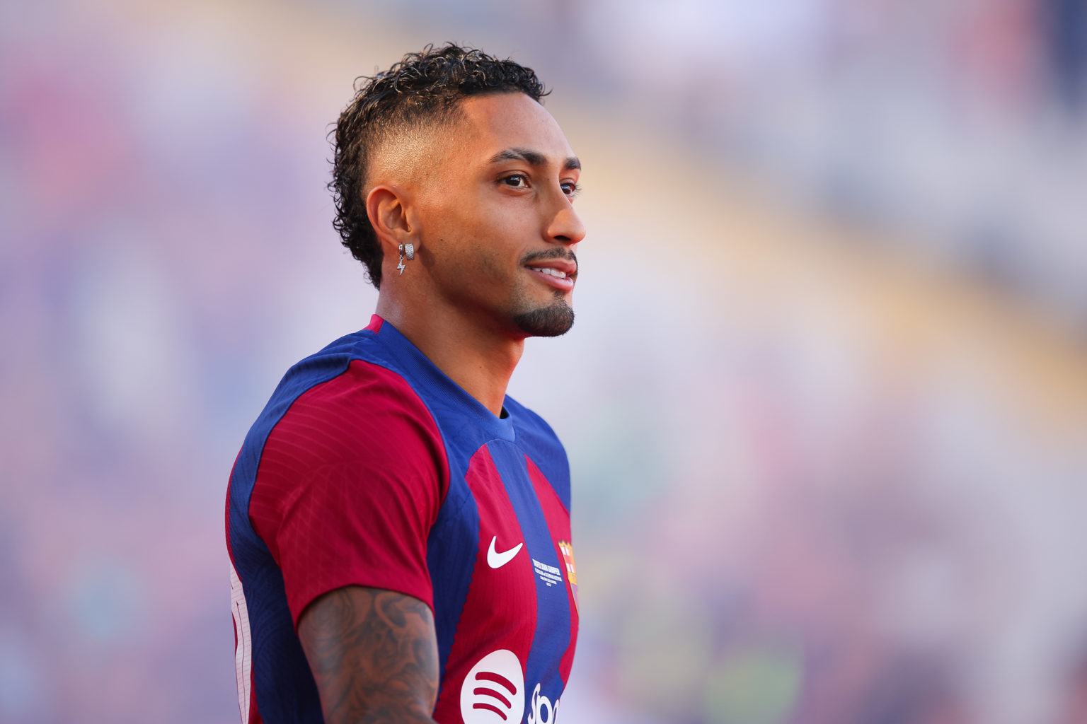 Raphael Dias Belloli 'Raphinha' of FC Barcelona waves the supporters during the presentation prior to the Joan Gamper Trophy match between FC Barce...