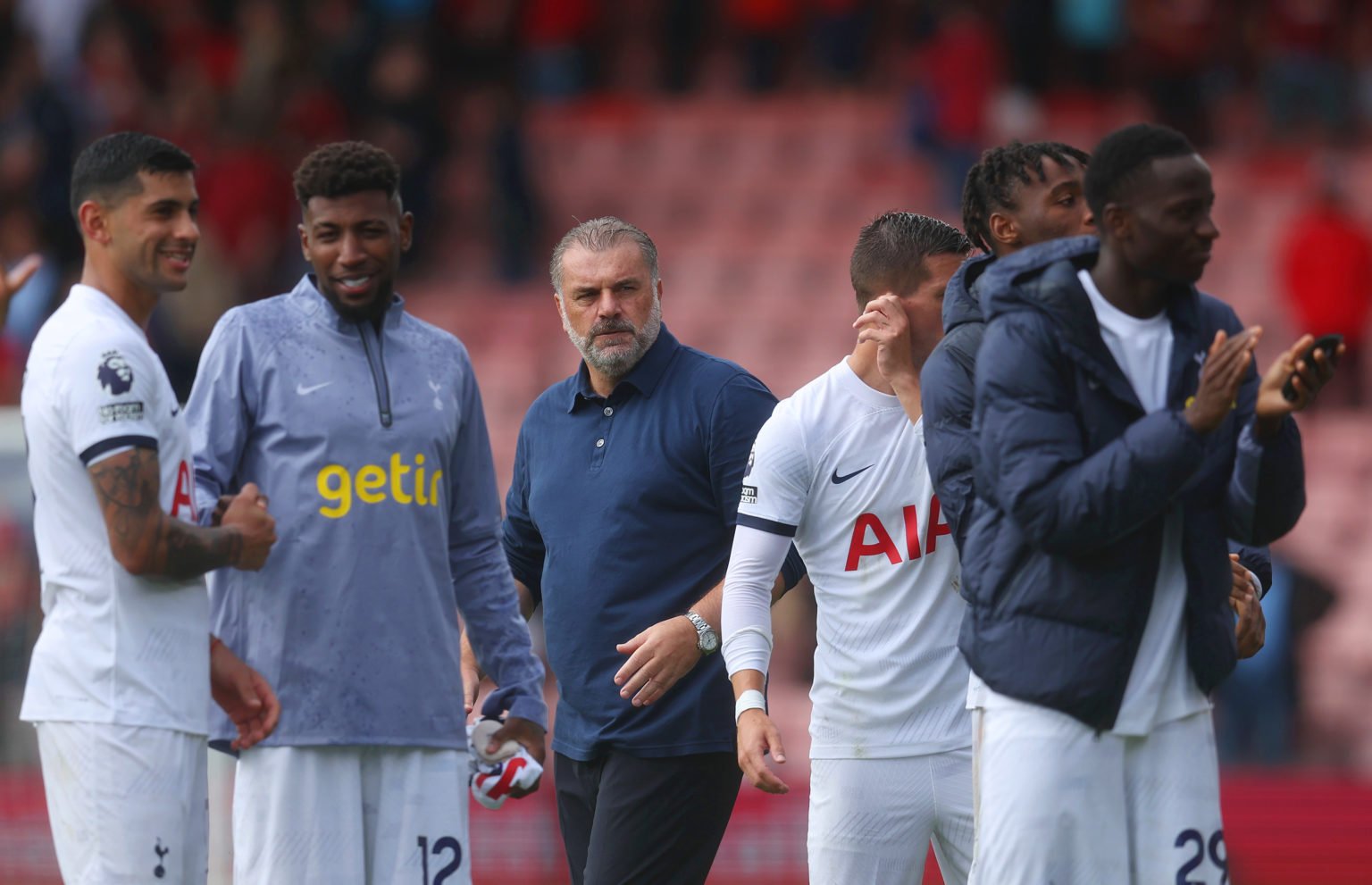 Ange Postecoglou, Manager of Tottenham Hotspur, looks on as his players applaud the fans following their victory in the Premier League match betwee...