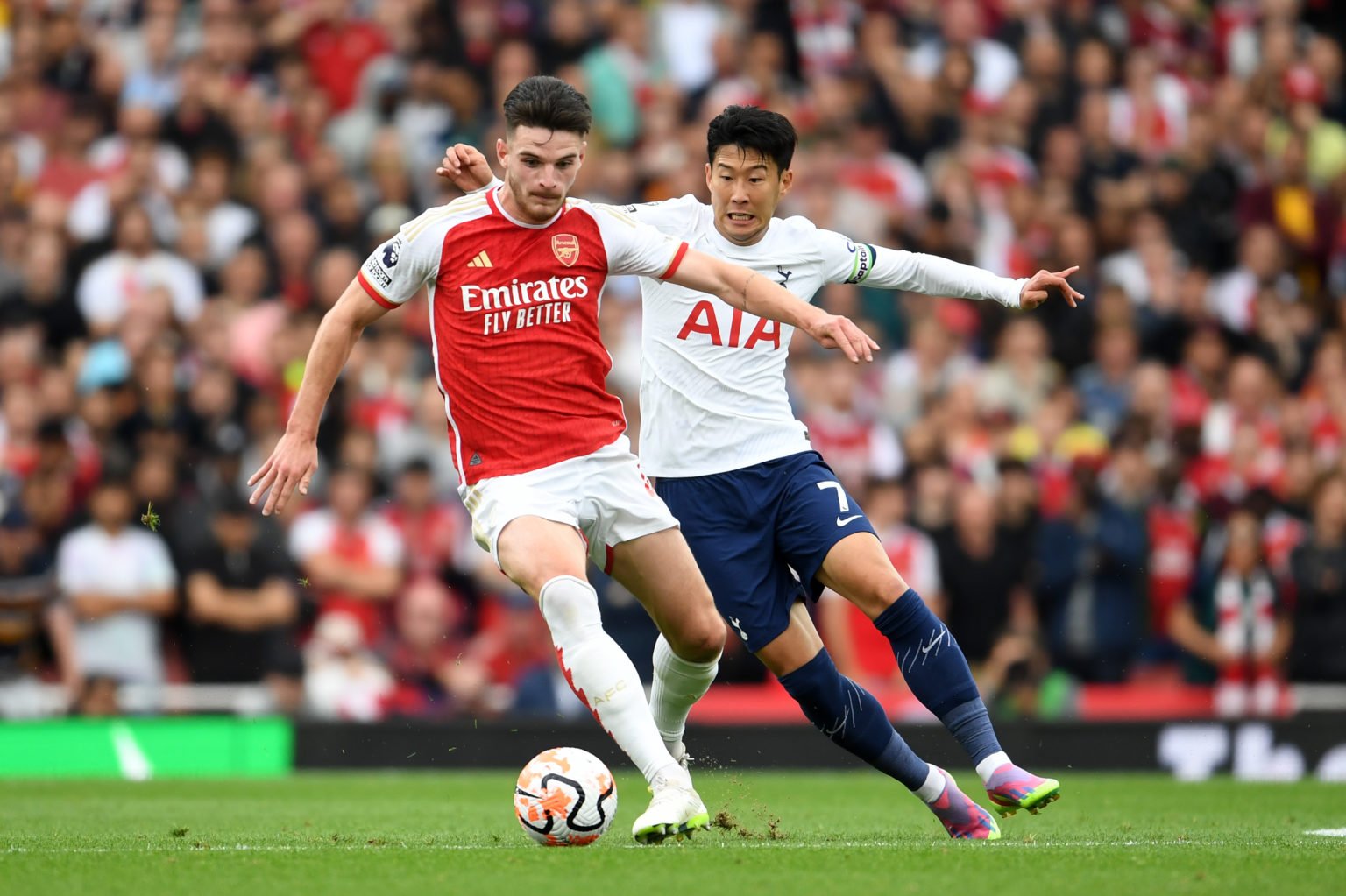 Declan Rice of Arsenal is challenged by Heung-Min Son of Tottenham Hotspur during the Premier League match between Arsenal FC and Tottenham Hotspur...