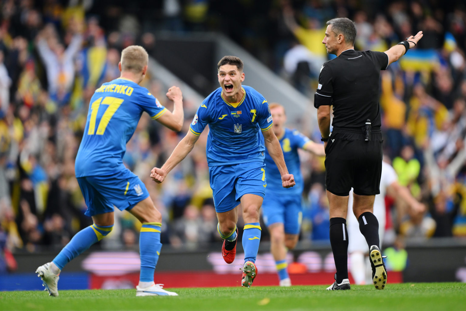 Georgiy Sudakov of Ukraine (C) celebrates with teammate Oleksandr Zinchenko after scoring the team's first goal during the UEFA EURO 2024 European ...