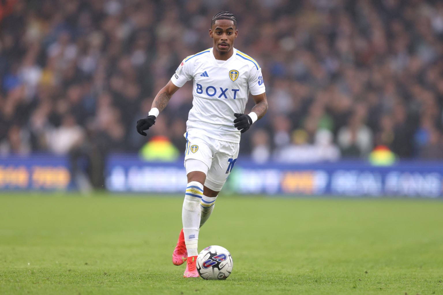 Crysencio Summerville of Leeds United runs with the ball during the Sky Bet Championship match between Leeds United and Huddersfield Town at Elland...