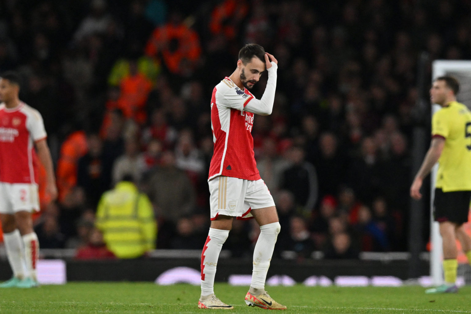 Arsenal's Portuguese midfielder #21 Fabio Vieira leaves the pitch having been sent off during the English Premier League football match between Ars...