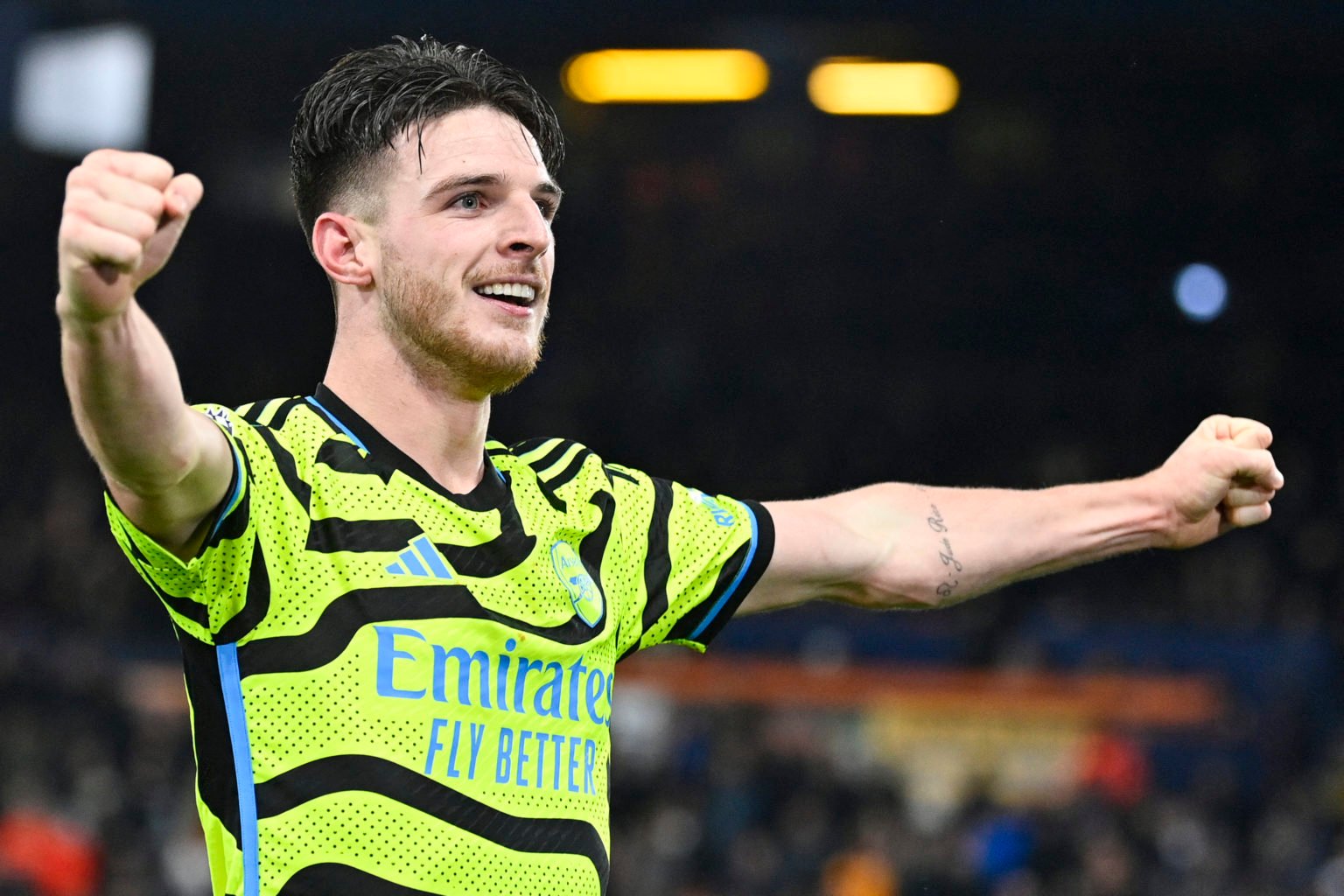 Arsenal's English midfielder #41 Declan Rice celebrates after scoring his team fourth goal during the English Premier League football match between...