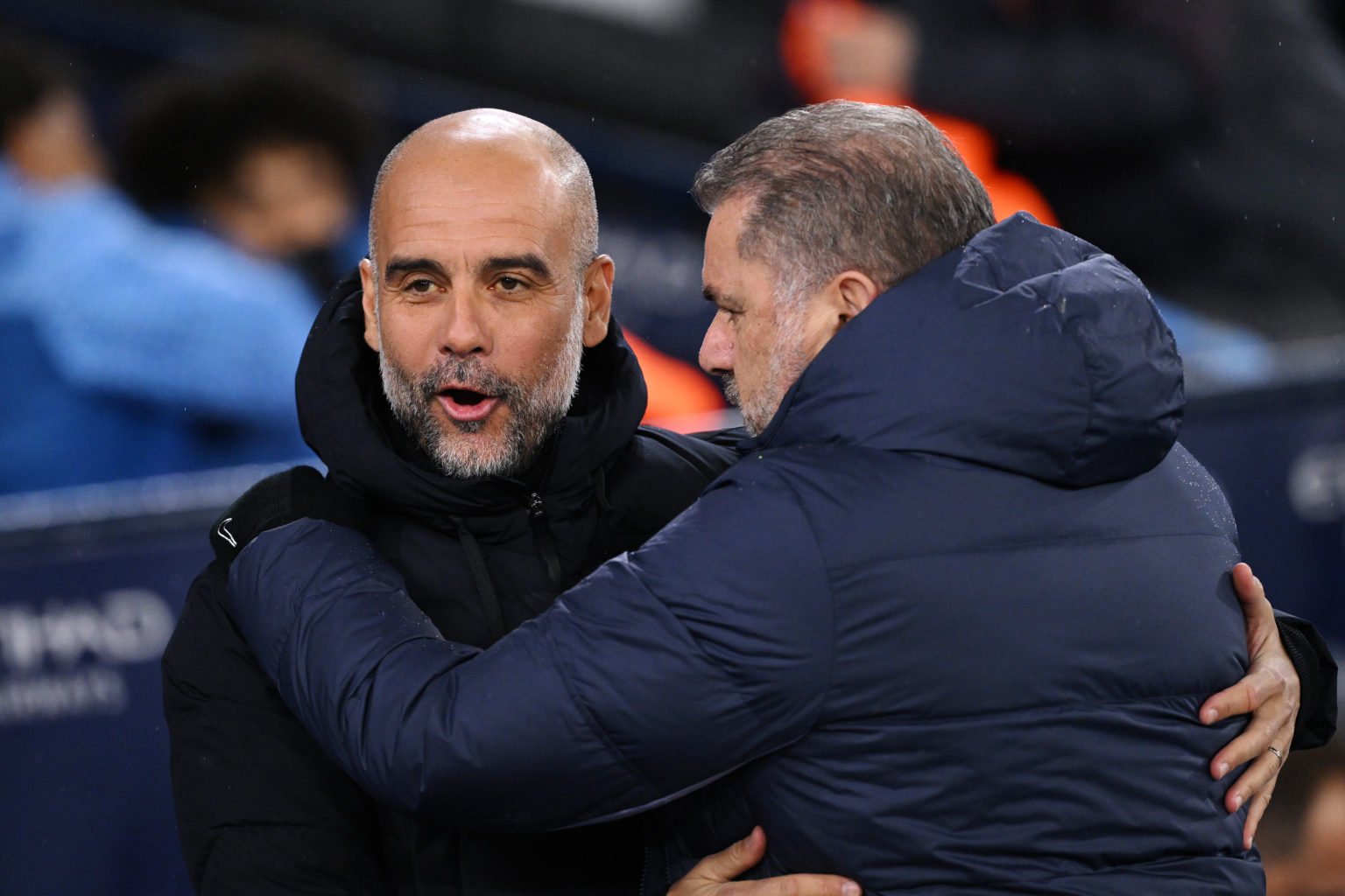 Pep Guardiola, Manager of Manchester City, embraces Ange Postecoglou, Manager of Tottenham Hotspur, prior to the Premier League match between Manch...