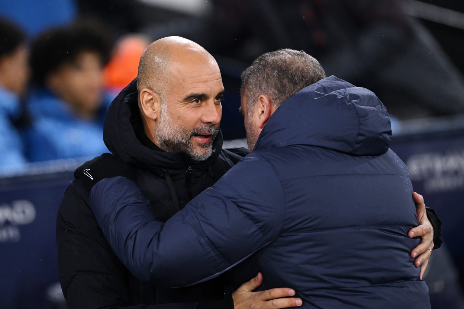 Pep Guardiola, Manager of Manchester City, embraces Ange Postecoglou, Manager of Tottenham Hotspur, prior to the Premier League match between Manch...