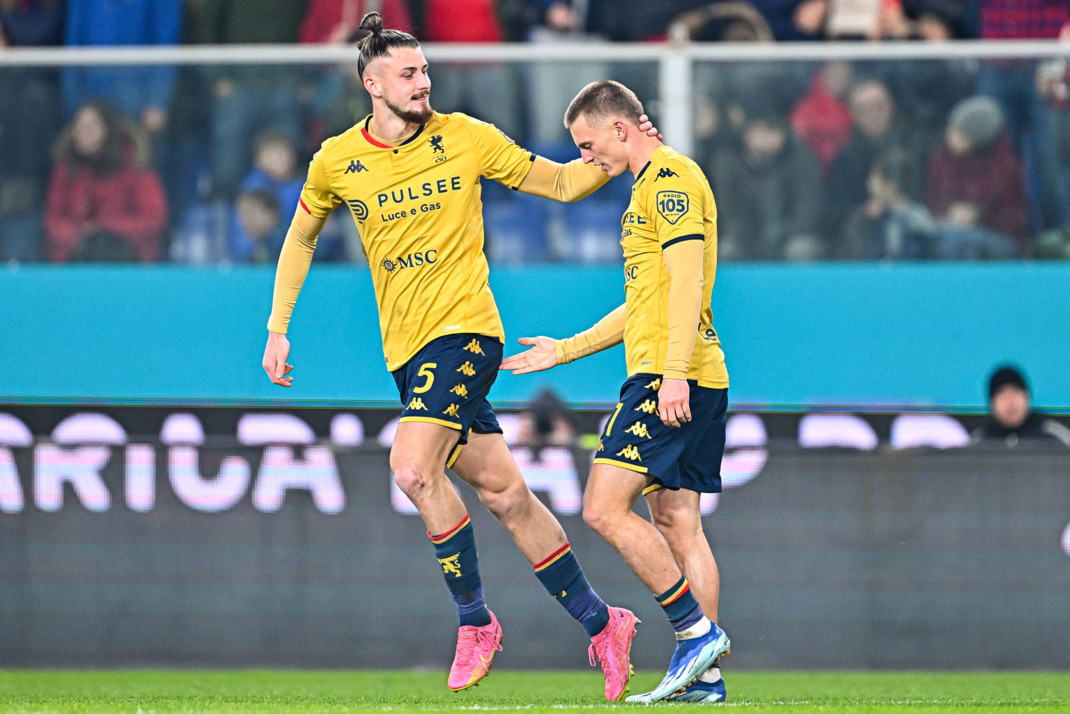 Albert Gudmundsson of Genoa (right) celebrates with his team-mate Radu Dragusin after scoring a goal during the Serie A TIM match between Genoa CFC...