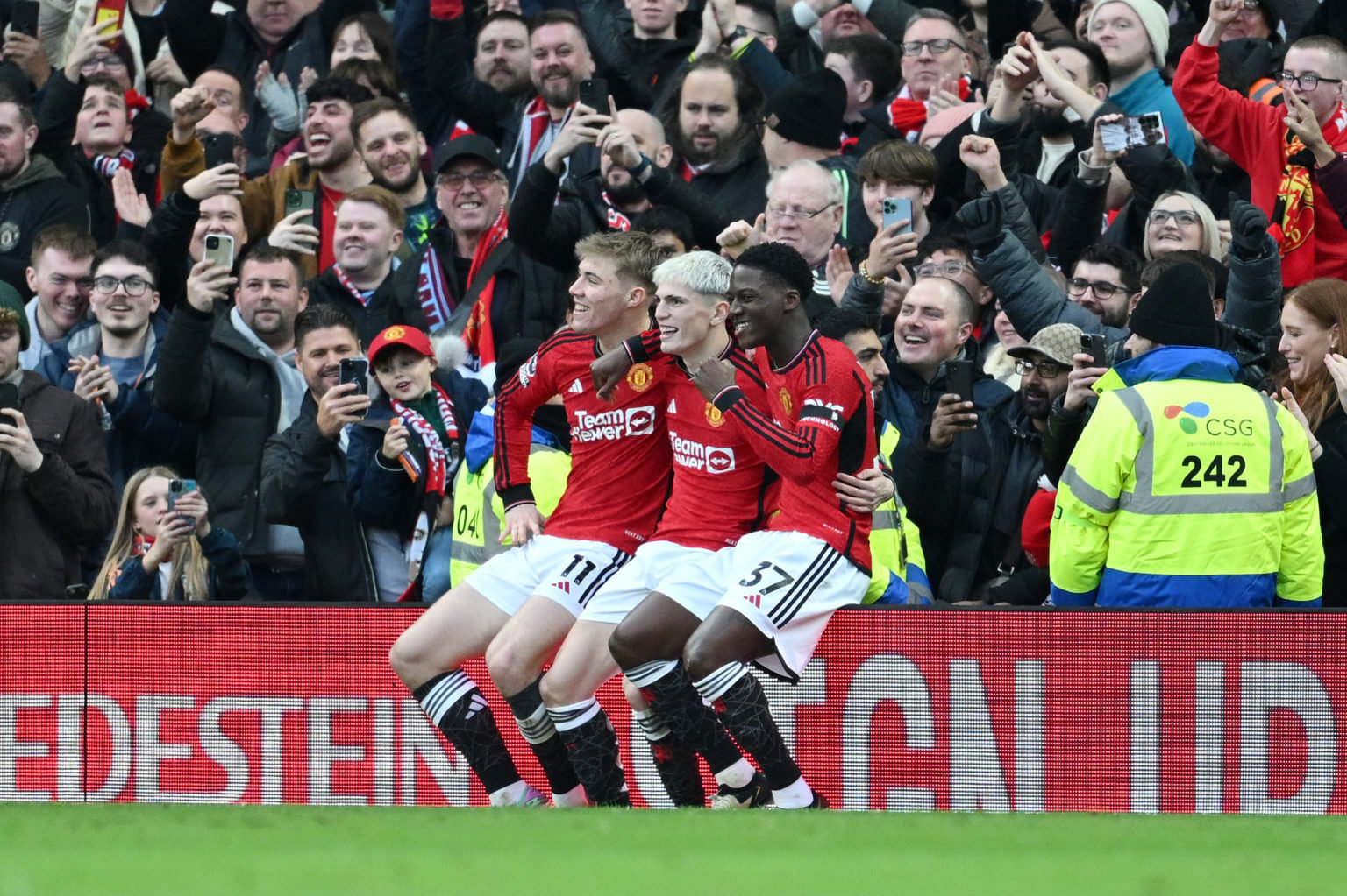 Alejandro Garnacho of Manchester United celebrates with Rasmus Hojlund and Kobbie Mainoo of Manchester United after scoring his team's second goal ...