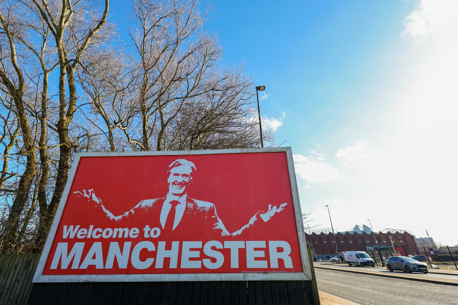 A billboard / poster of Sir Jim Ratcliffe, owner of Ineos and co-owner of Manchester United seen on Wharfside Way following the confirmation of his...