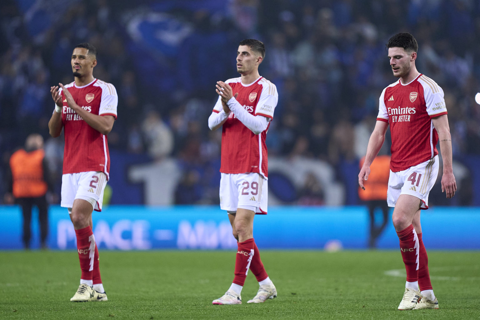 William Saliba (L), Kai Havertz (C) and Declan Rice of Arsenal FC react at the end of the UEFA Champions League 2023/24 round of 16 first leg match...