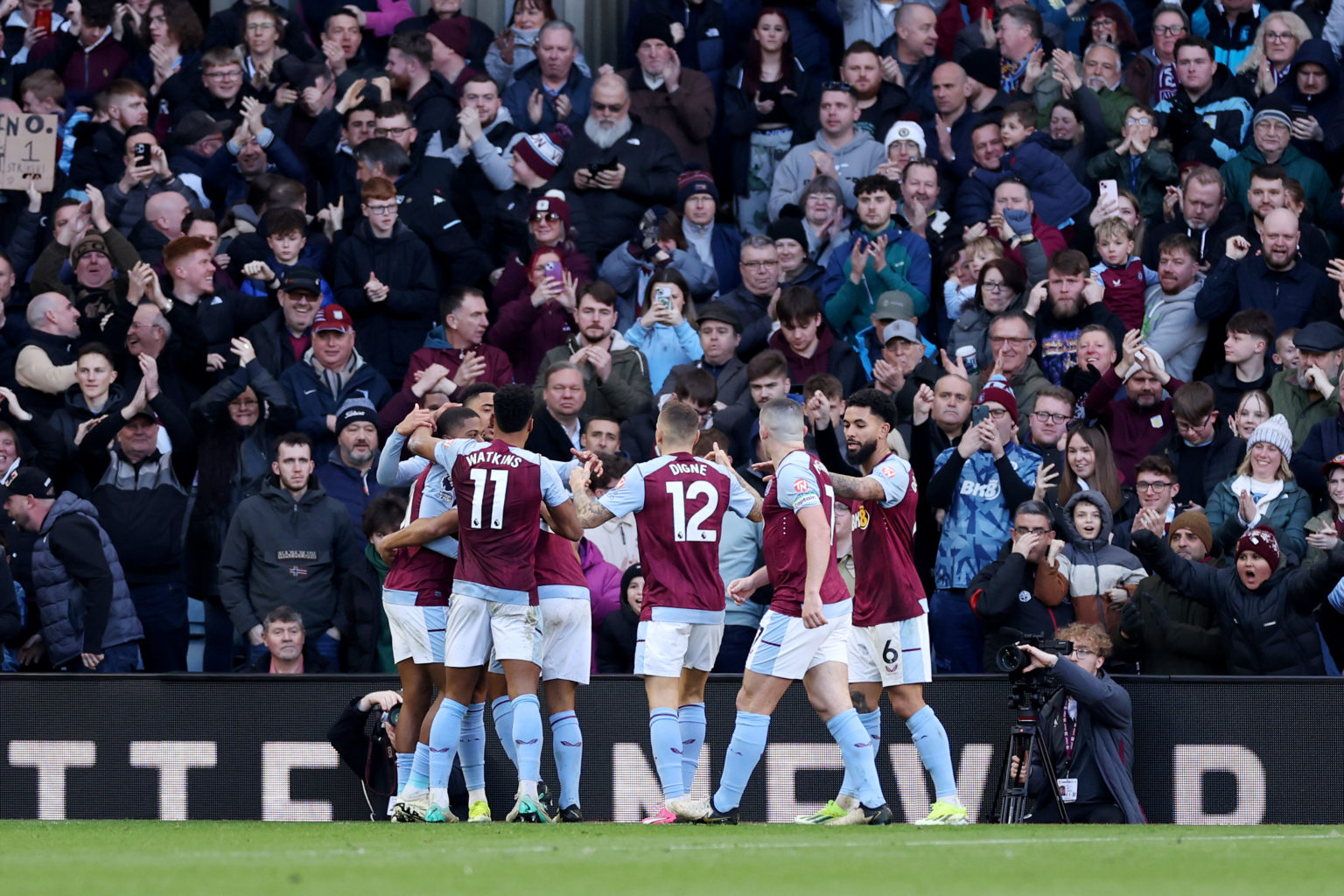 Leon Bailey of Aston Villa (obscured) celebrates scoring his team's fourth goal with teammates during the Premier League match between Aston Villa ...