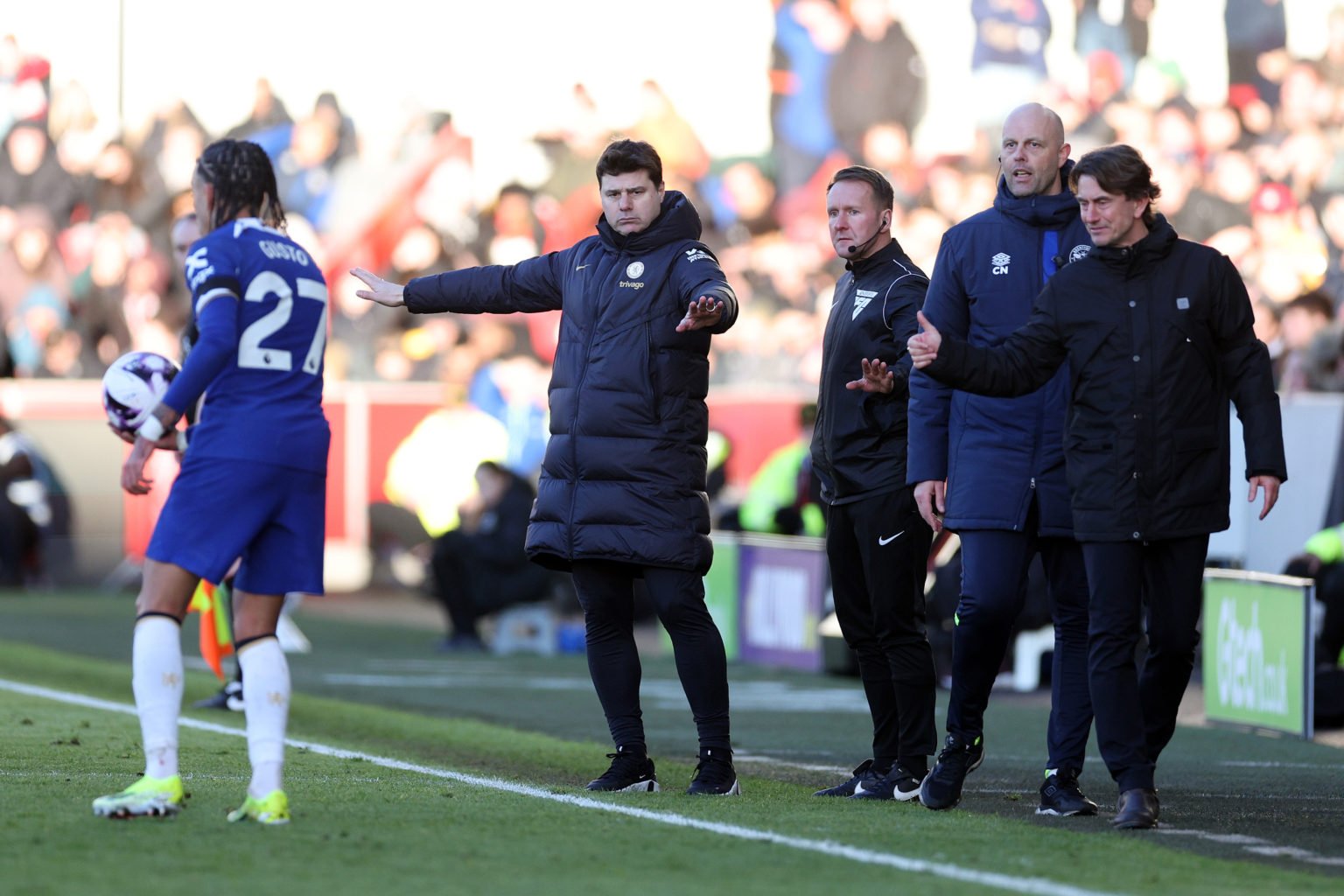 Mauricio Pochettino, Manager of Chelsea, and Thomas Frank, Manager of Brentford, react during the Premier League match between Brentford FC and Che...