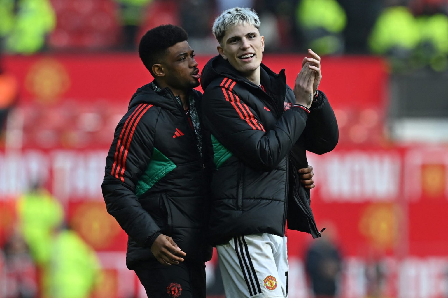 Manchester United's Ivorian midfielder #16 Amad Diallo (L) and Manchester United's Argentinian midfielder #17 Alejandro Garnacho (R) celebrate on t...