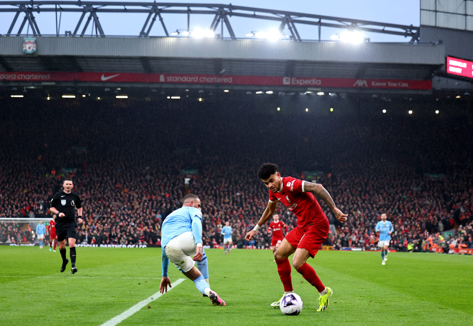 Luis Diaz of Liverpool tries make it past Kyle Walker of Manchester City during the Premier League match between Liverpool FC and Manchester City a...