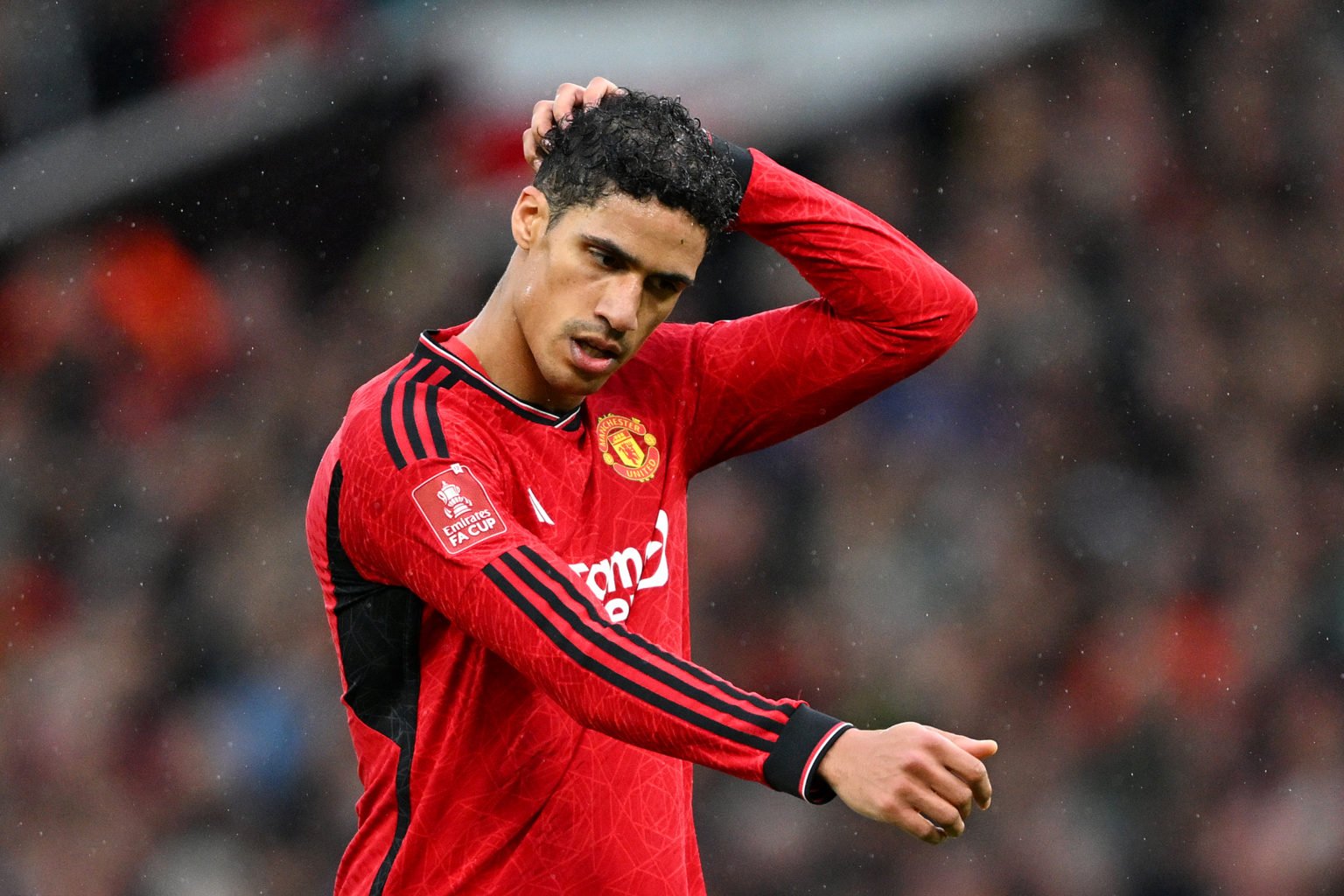 Raphael Varane of Manchester United reacts during the Emirates FA Cup Quarter Final between Manchester United and Liverpool FC at Old Trafford on M...