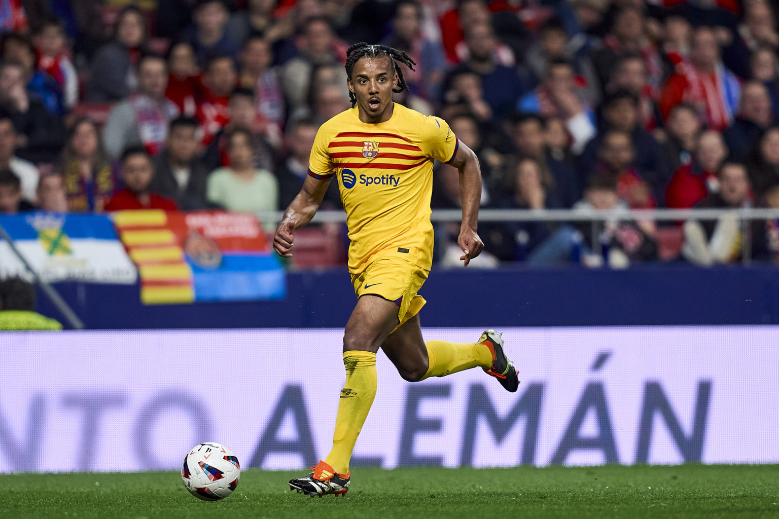 Jules Kounde of FC Barcelona runs with the ball during the LaLiga EA Sports match between Atletico Madrid and FC Barcelona at Civitas Metropolitano...