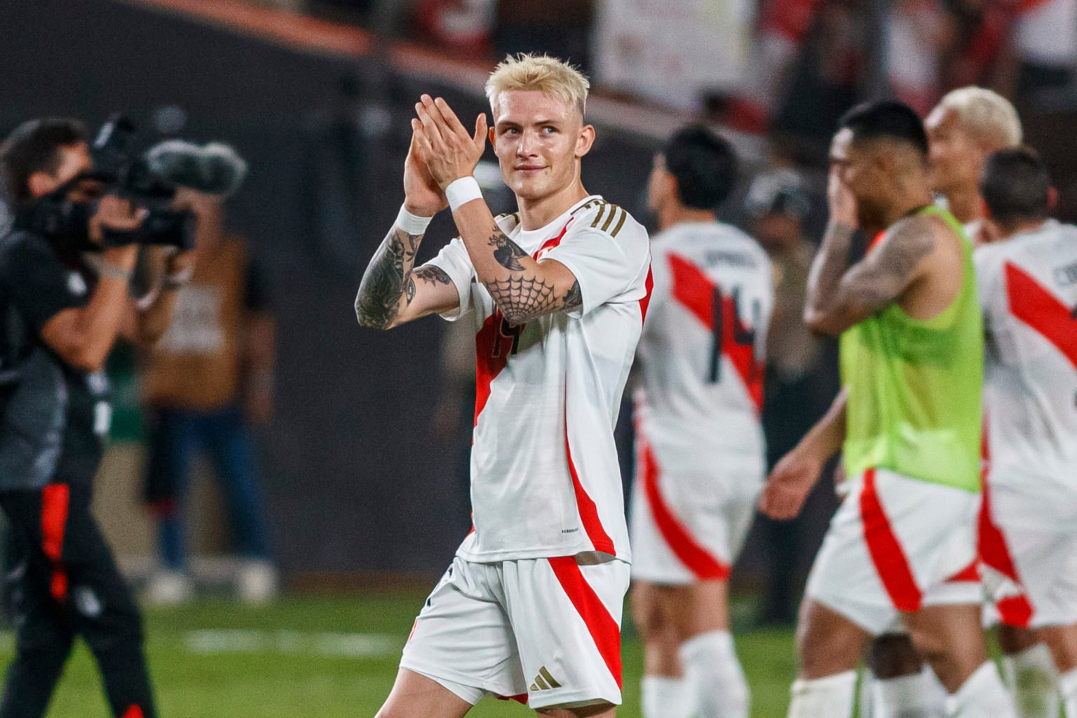 Oliver Sonne of Peru greets the fans aftter the friendly match between Peru and Dominican Republic at Estadio Monumental on March 26, 2024 in Lima,...