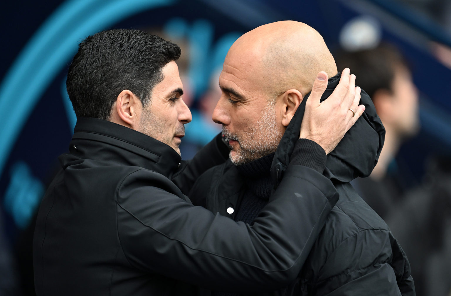 Mikel Arteta, Manager of Arsenal, interacts with Pep Guardiola, Manager of Manchester City, prior to the Premier League match between Manchester Ci...