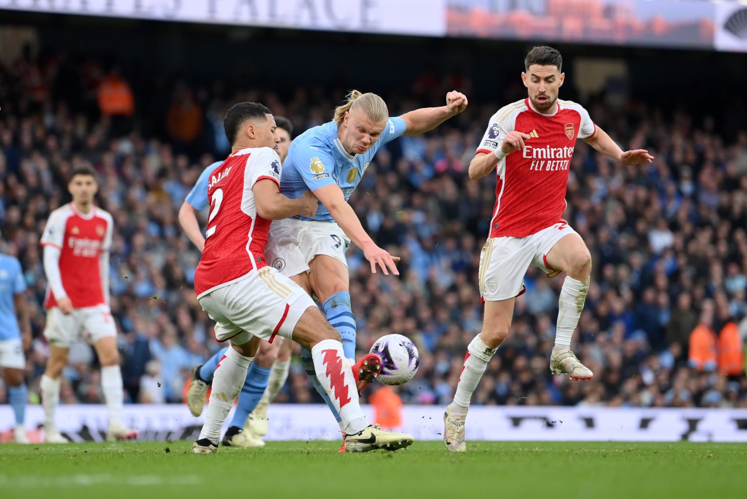 Erling Haaland of Manchester City is challenged by William Saliba of Arsenal during the Premier League match between Manchester City and Arsenal FC...