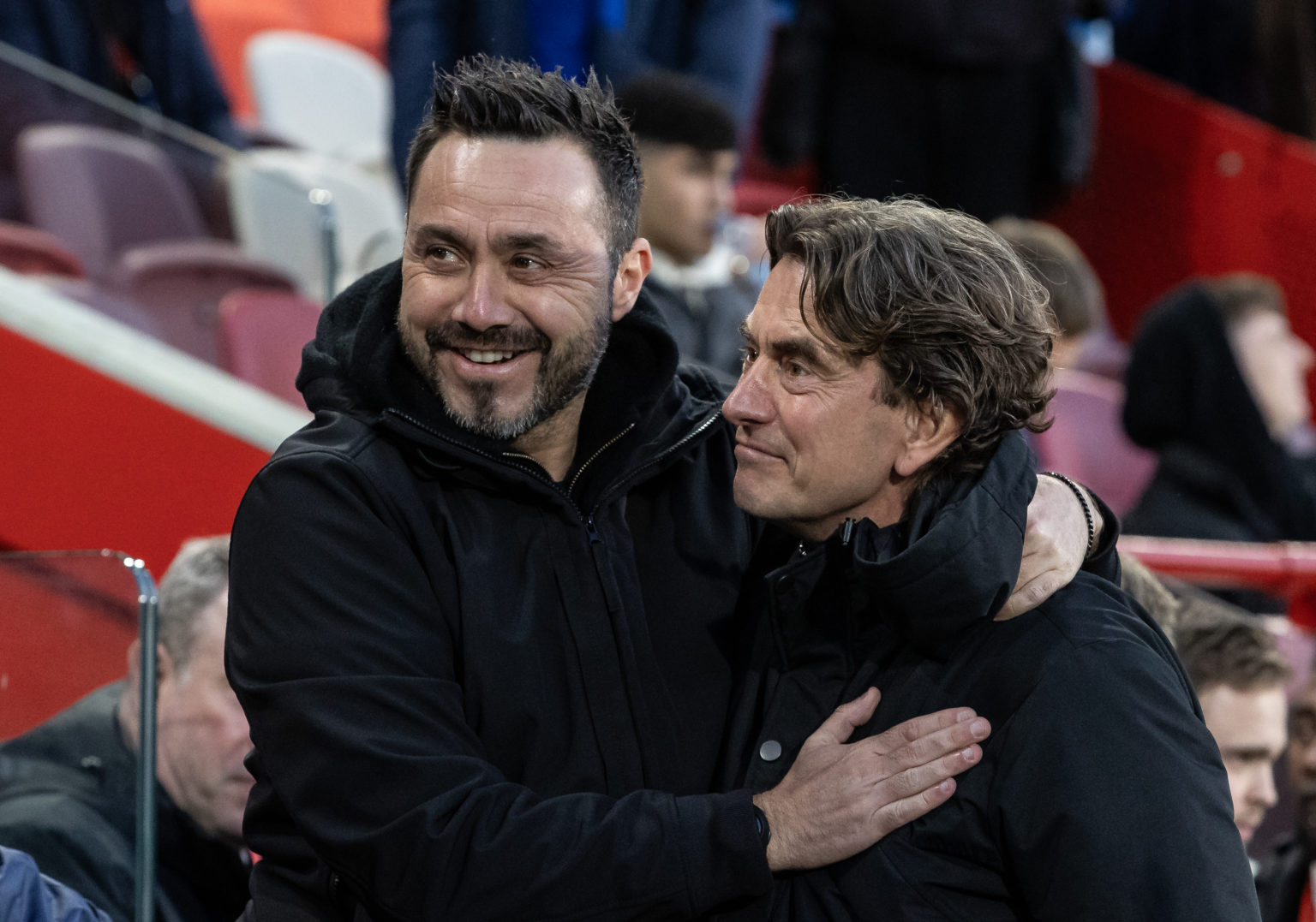 Brentford's manager Thomas Frank (right) greets Brighton & Hove Albion's manager Roberto de Zerbi during the Premier League match between Brent...