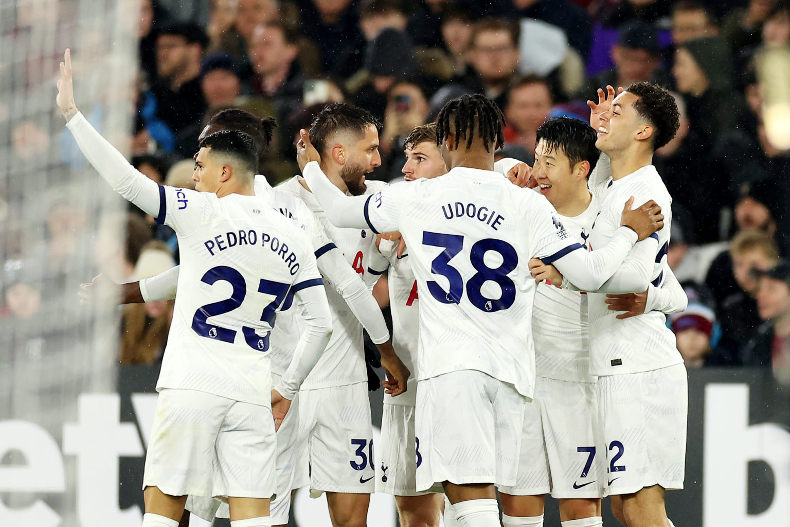 Brennan Johnson of Tottenham Hotspur celebrates scoring his team's first goal with teammates during the Premier League match between West Ham Unite...