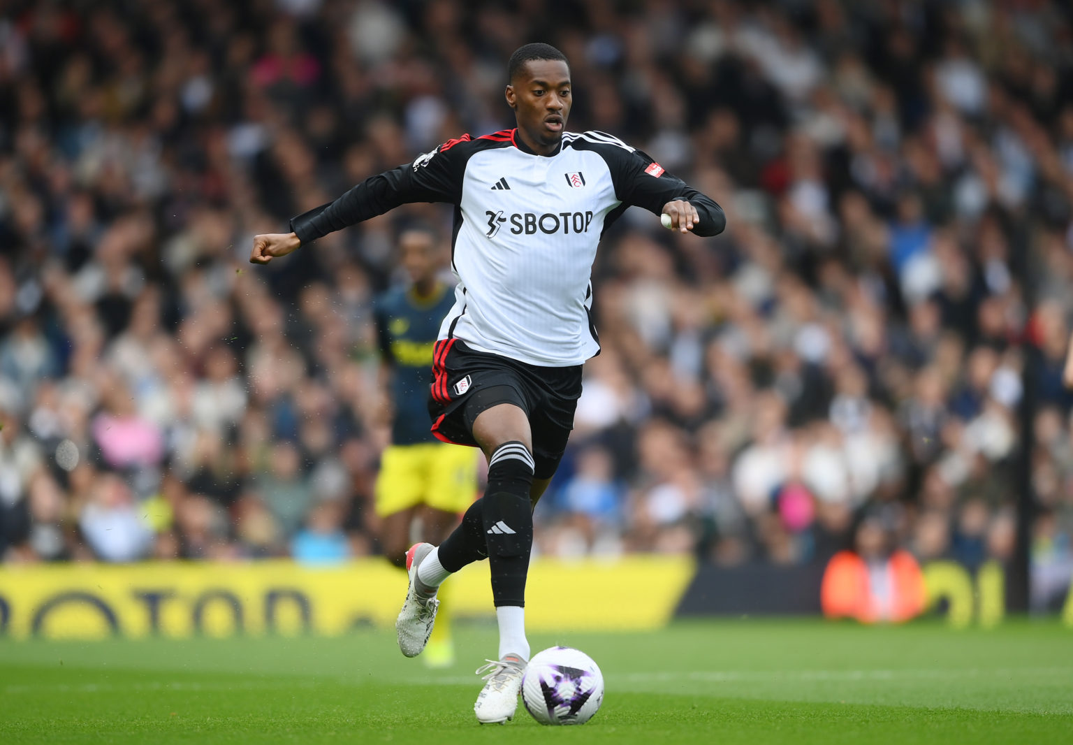 Tosin Adarabioyo of Fulham runs with the ball during the Premier League match between Fulham FC and Newcastle United at Craven Cottage on April 06,...