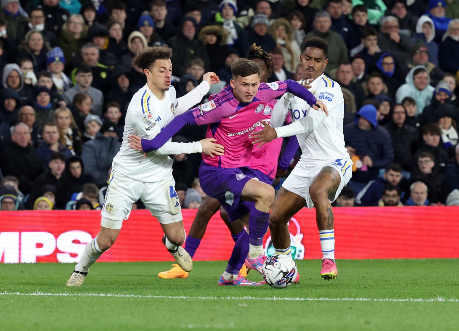 Chris Rigg of Sunderland tries to break free of the Leeds defenders during to the Sky Bet Championship match between Leeds United and Sunderland at...