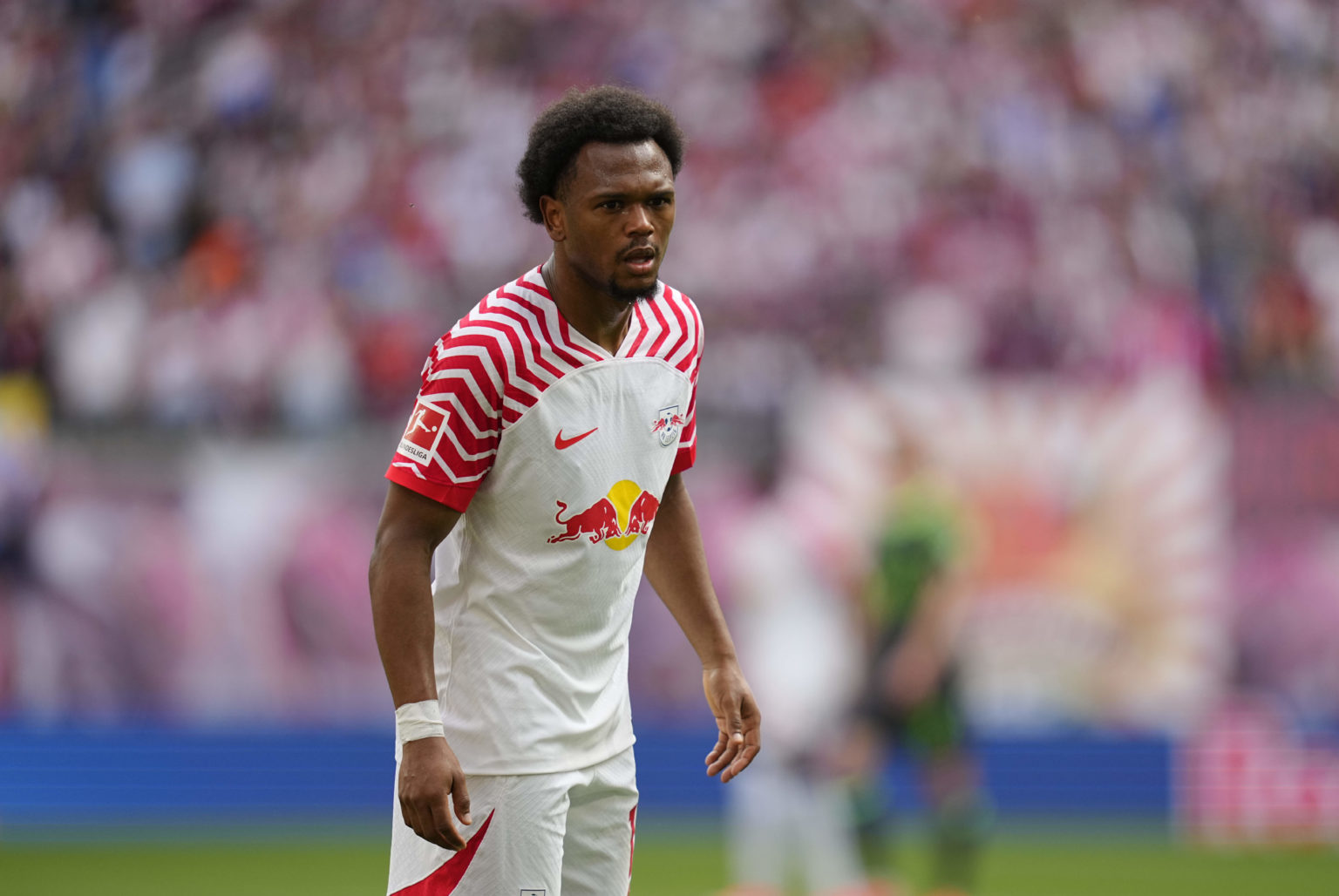 Loïs Openda of RB Leipzig looks on during the Bundesliga match between RB Leipzig and VfL Wolfsburg at Red Bull Arena on April 13, 2024 in Leipzig,...