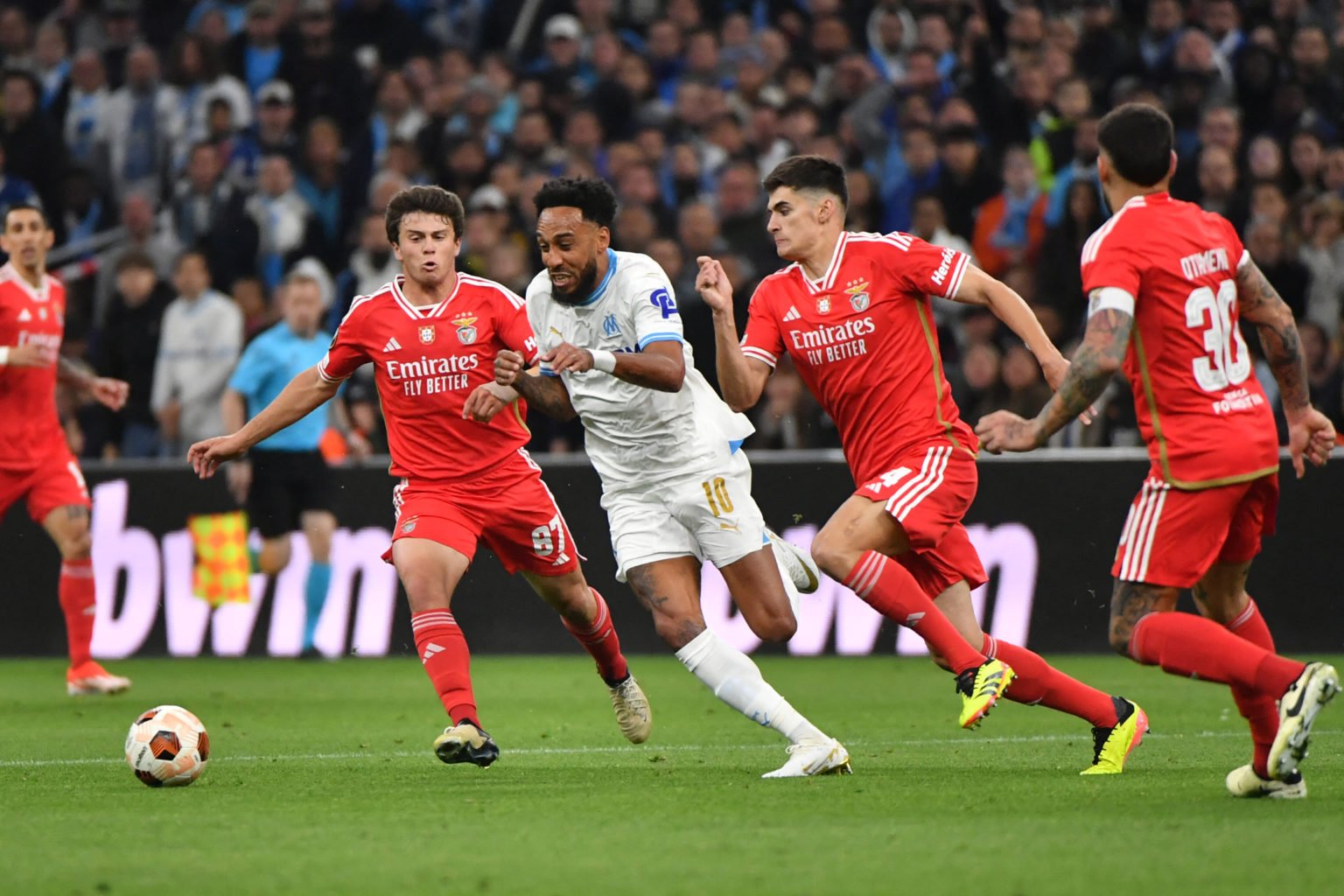 Benfica's Portuguese midfielder #87 Joao Neves and Benfica's Portuguese defender #04 Antonio Silva fight for the ball with Marseille's French-Gabon...