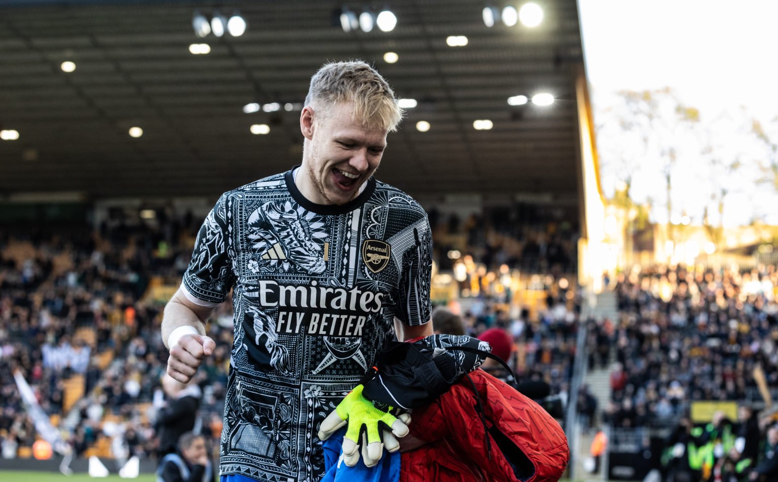 Arsenal's Aaron Ramsdale takes his place on the bench  during the Premier League match between Wolverhampton Wanderers and Arsenal FC at Molineux o...