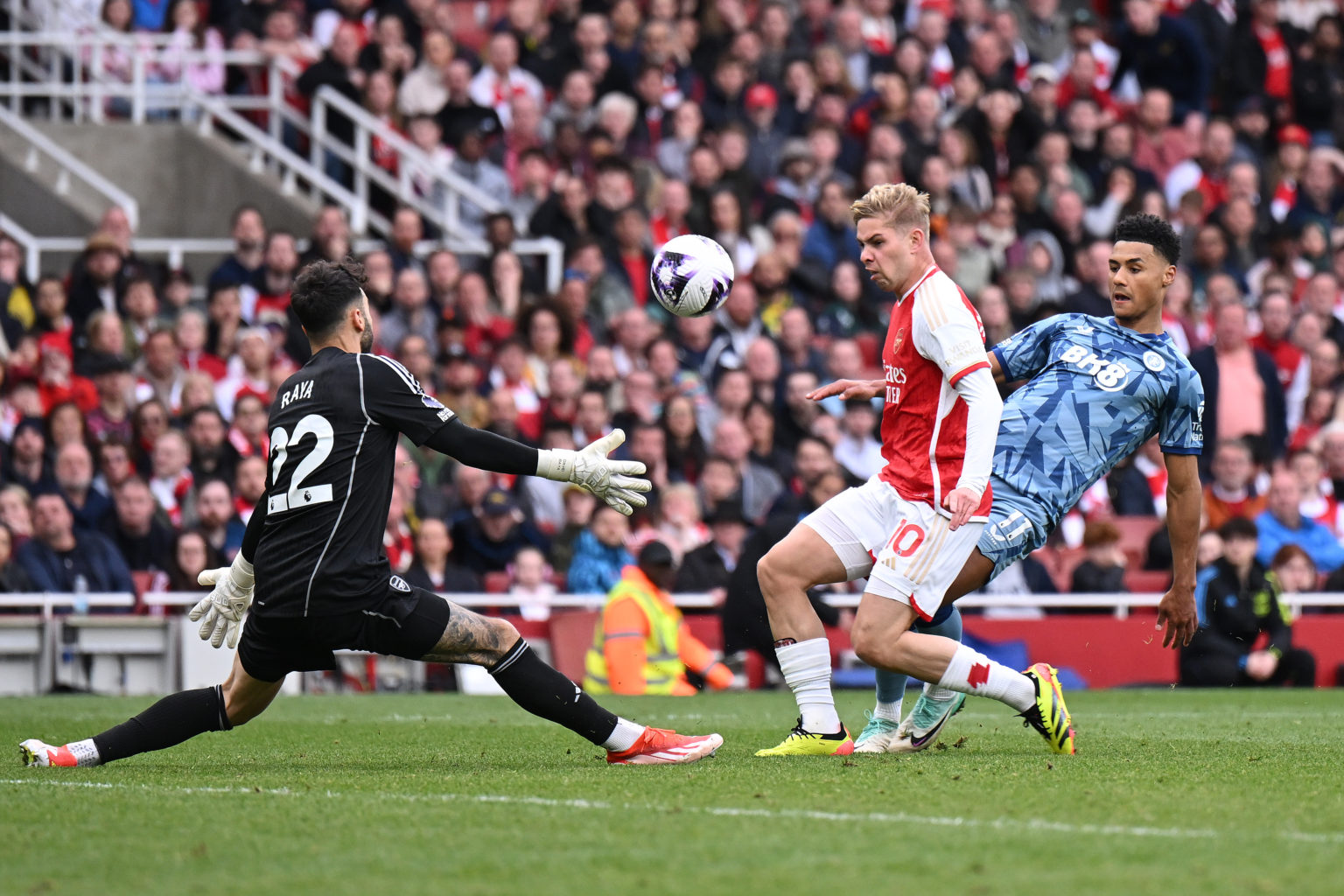 Ollie Watkins of Aston Villa scores his team's 2nd goal despite the efforts of Emile Smith Rowe and David Raya of Arsenal during the Premier League...