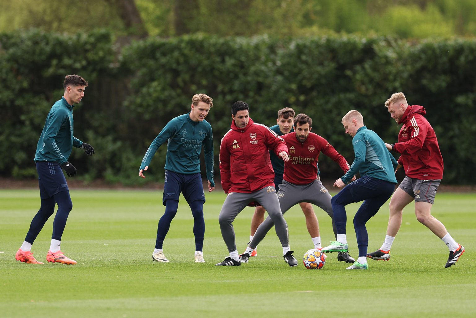 Mikel Arteta, Manager of Arsenal, participates in a training session alongside his players Kai Havertz, Martin Odegaard and Oleksandr Zinchenko at ...