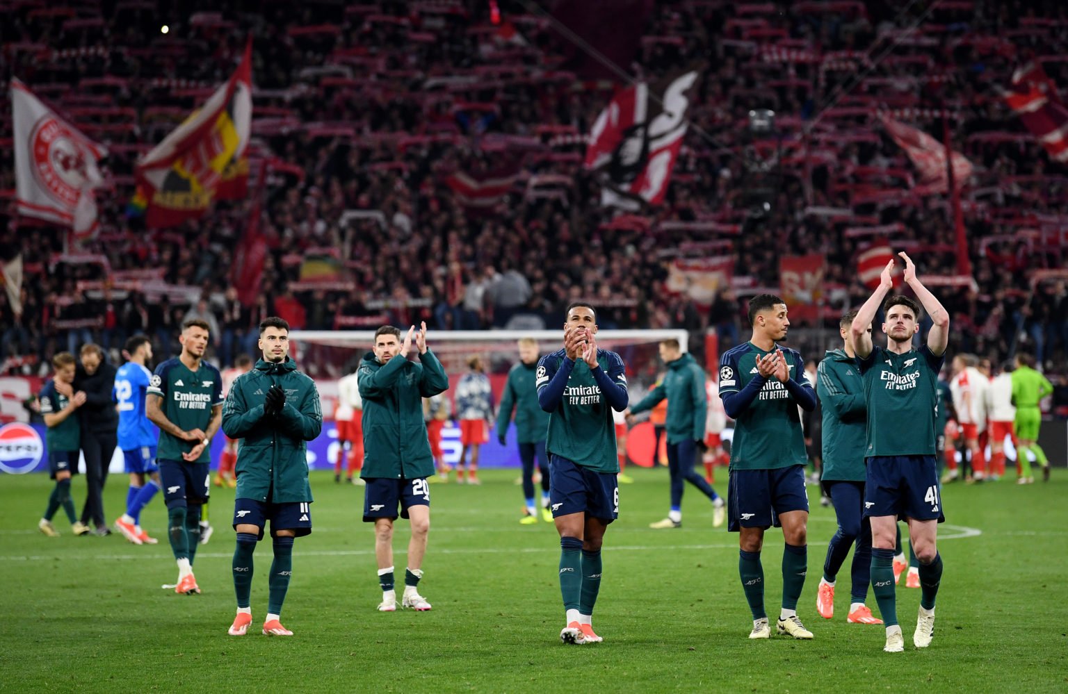 Players of Arsenal applaud the fans after the team's defeat and elimination from the UEFA Champions League after the UEFA Champions League quarter-...