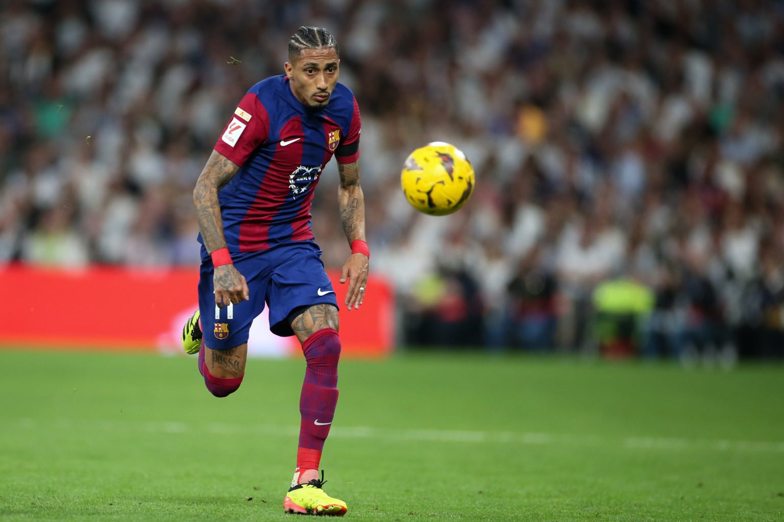 Raphinha of FC Barcelona in action during the LaLiga EA Sports match between Real Madrid CF and FC Barcelona at Estadio Santiago Bernabeu on April ...