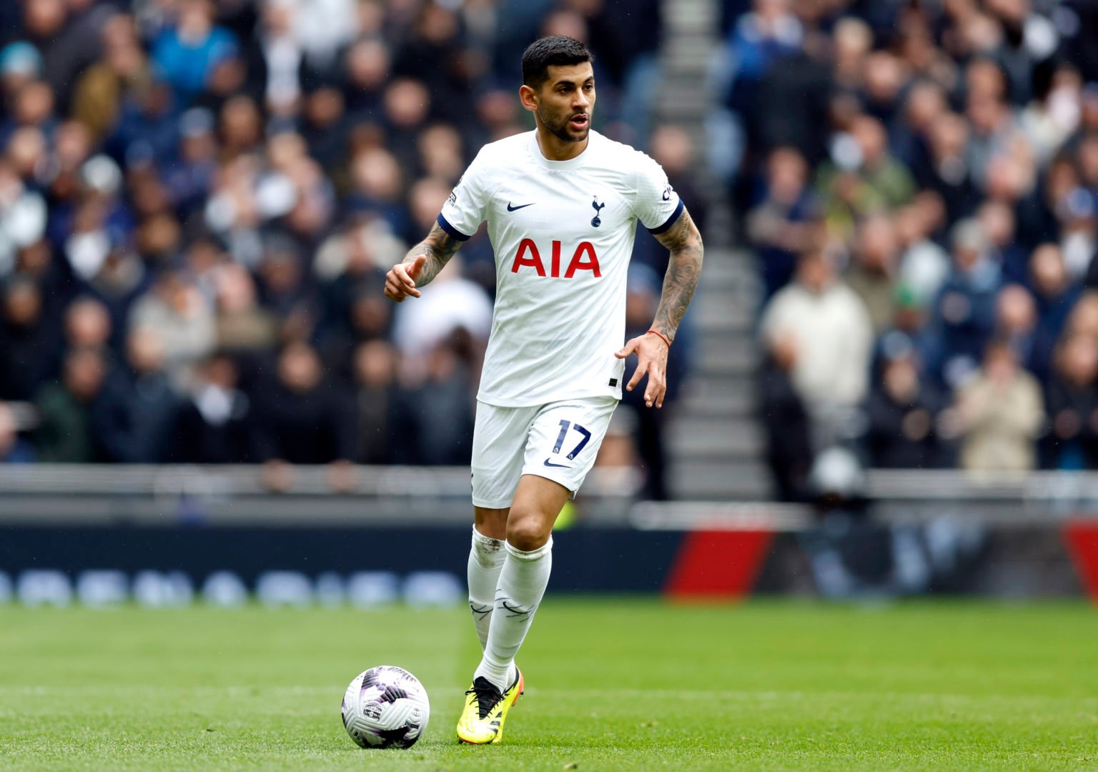 Cristian Romero of Tottenham Hotspur on the ball during the Premier League match between Tottenham Hotspur and Arsenal FC at Tottenham Hotspur Stad...