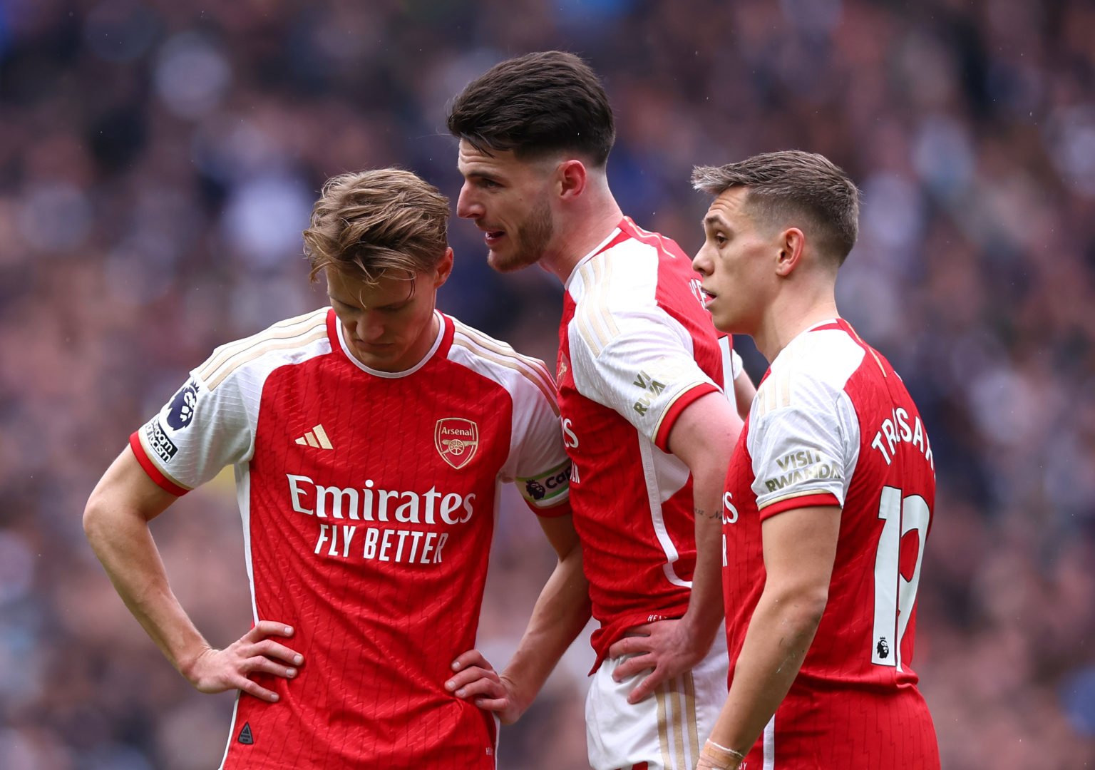 Declan Rice of Arsenal talks to Martin Odegaard of Arsenal during the Premier League match between Tottenham Hotspur and Arsenal FC at Tottenham Ho...