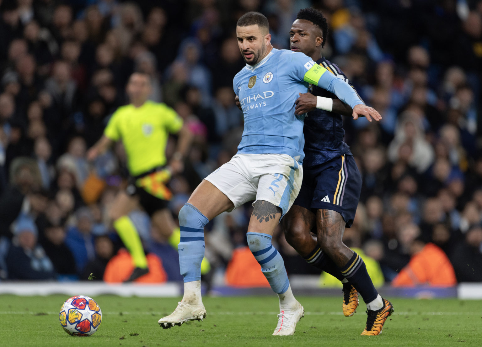 Kyle Walker of Manchester City and Vinicius Junior of Real Madrid CF during the UEFA Champions League quarter-final second leg match between Manche...