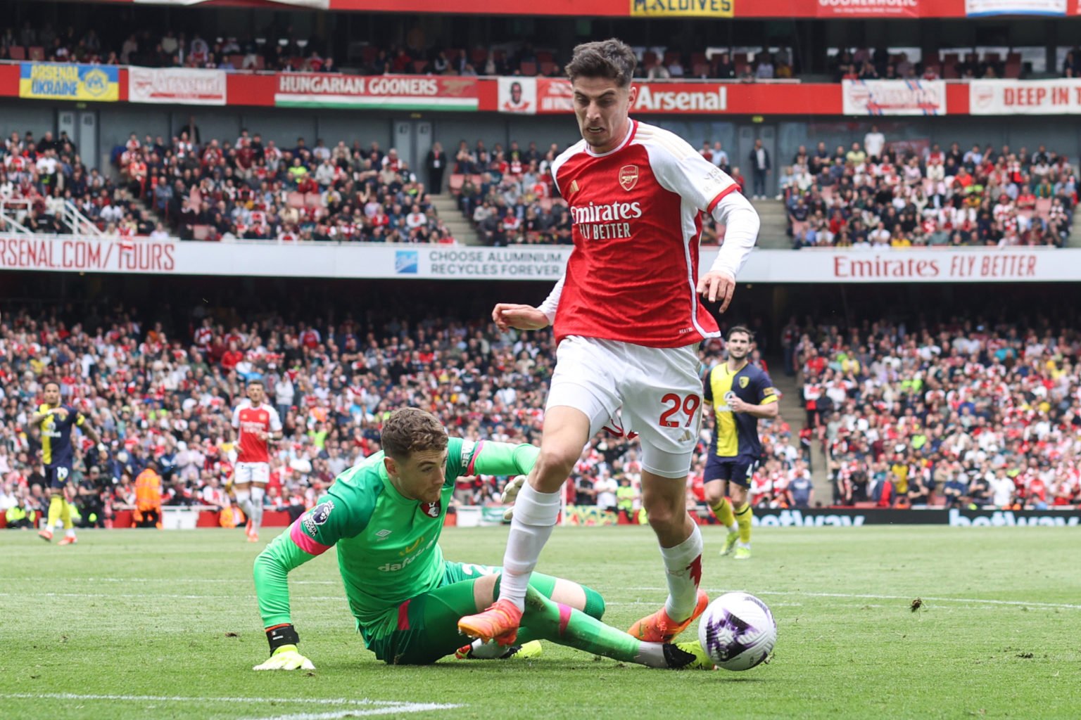 Bournemouth goalkeeper Mark Travers fouls Kai Havertz of Arsenal to give away a penalty  during the Premier League match between Arsenal FC and AFC...