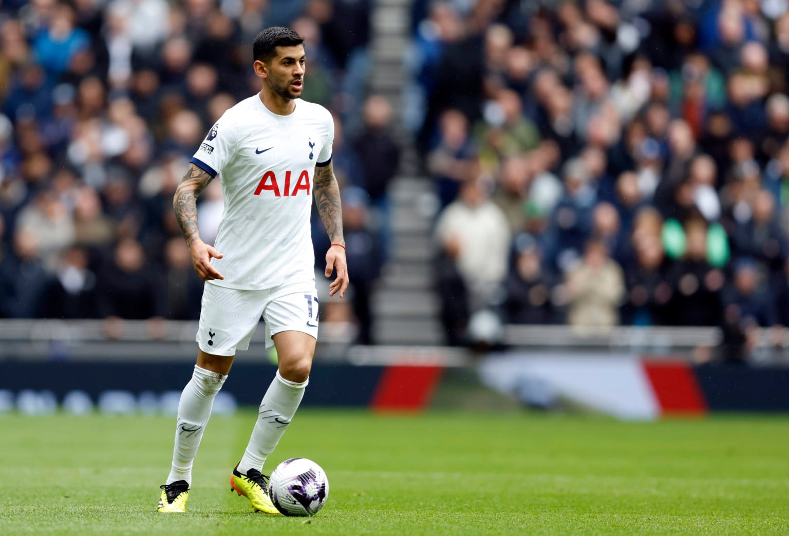 Cristian Romero of Tottenham Hotspur on the ball during the Premier League match between Tottenham Hotspur and Arsenal FC at Tottenham Hotspur Stad...